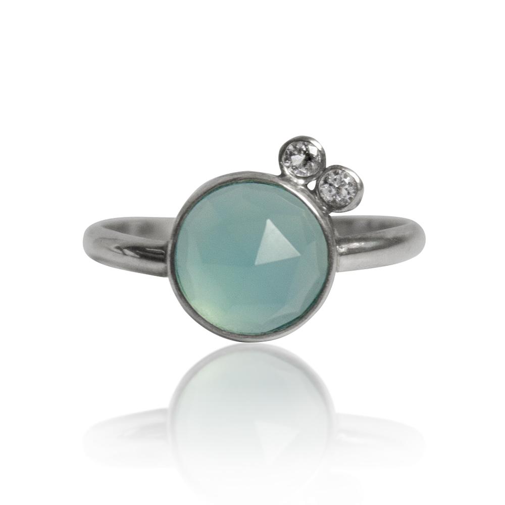 Aqua Chalcedony & White Topaz Sterling Silver Ring featuring an 8mm round aqua chalcedony and two 2mm round white topaz stones in a handcrafted design.