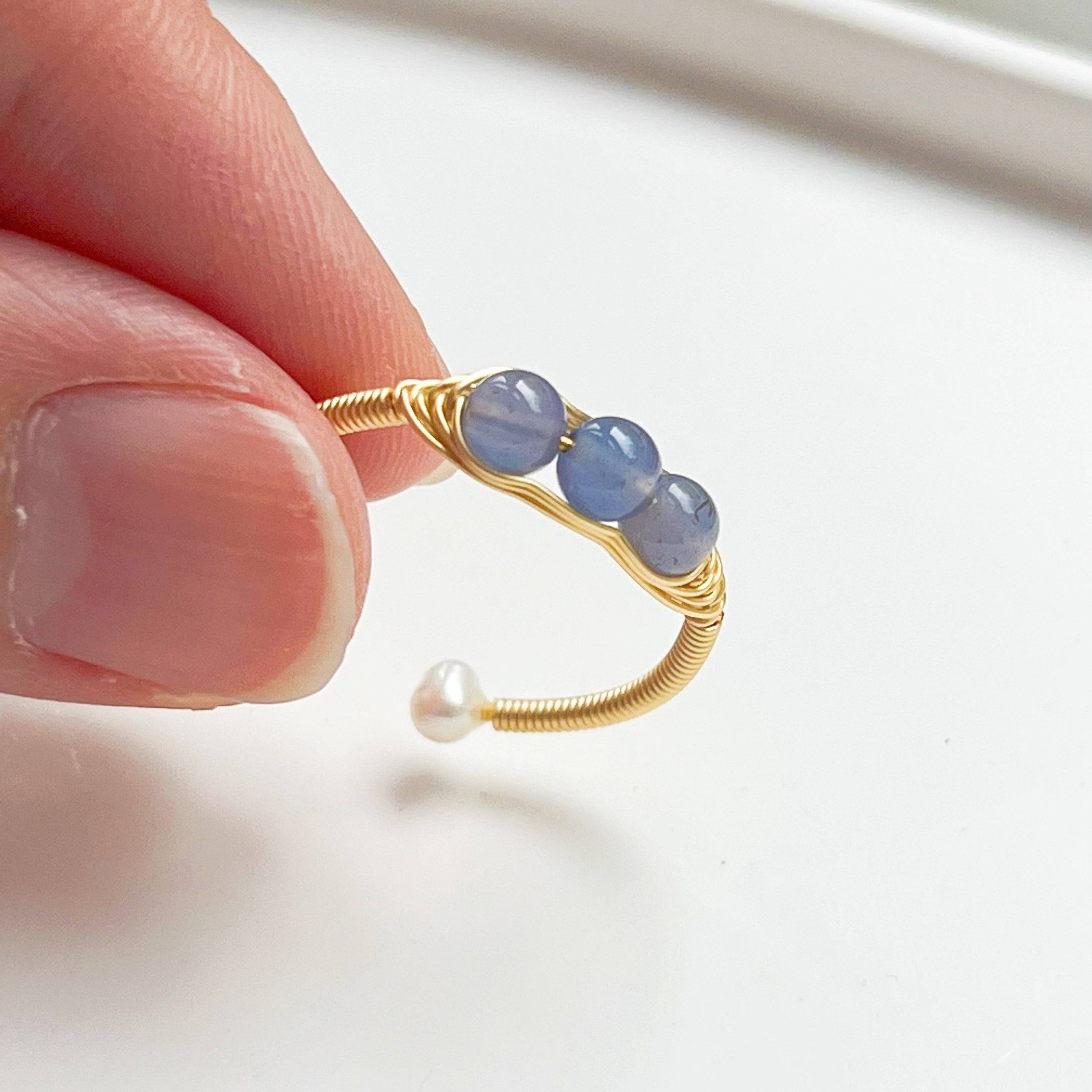 Aquamarine and Pearl Bead Adjustable Ring featuring three natural aquamarine beads on gold-plated bronze wire, showcasing its elegant design.