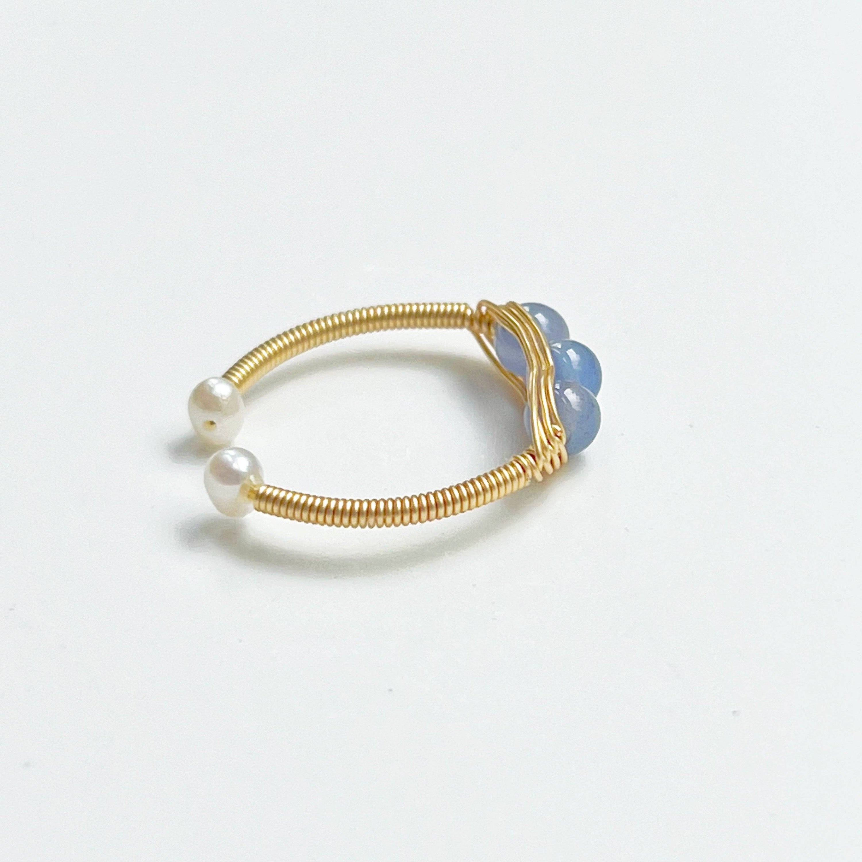 Aquamarine and Pearl Bead Adjustable Ring featuring three natural aquamarine beads on gold-plated bronze wire, showcasing its elegant design.