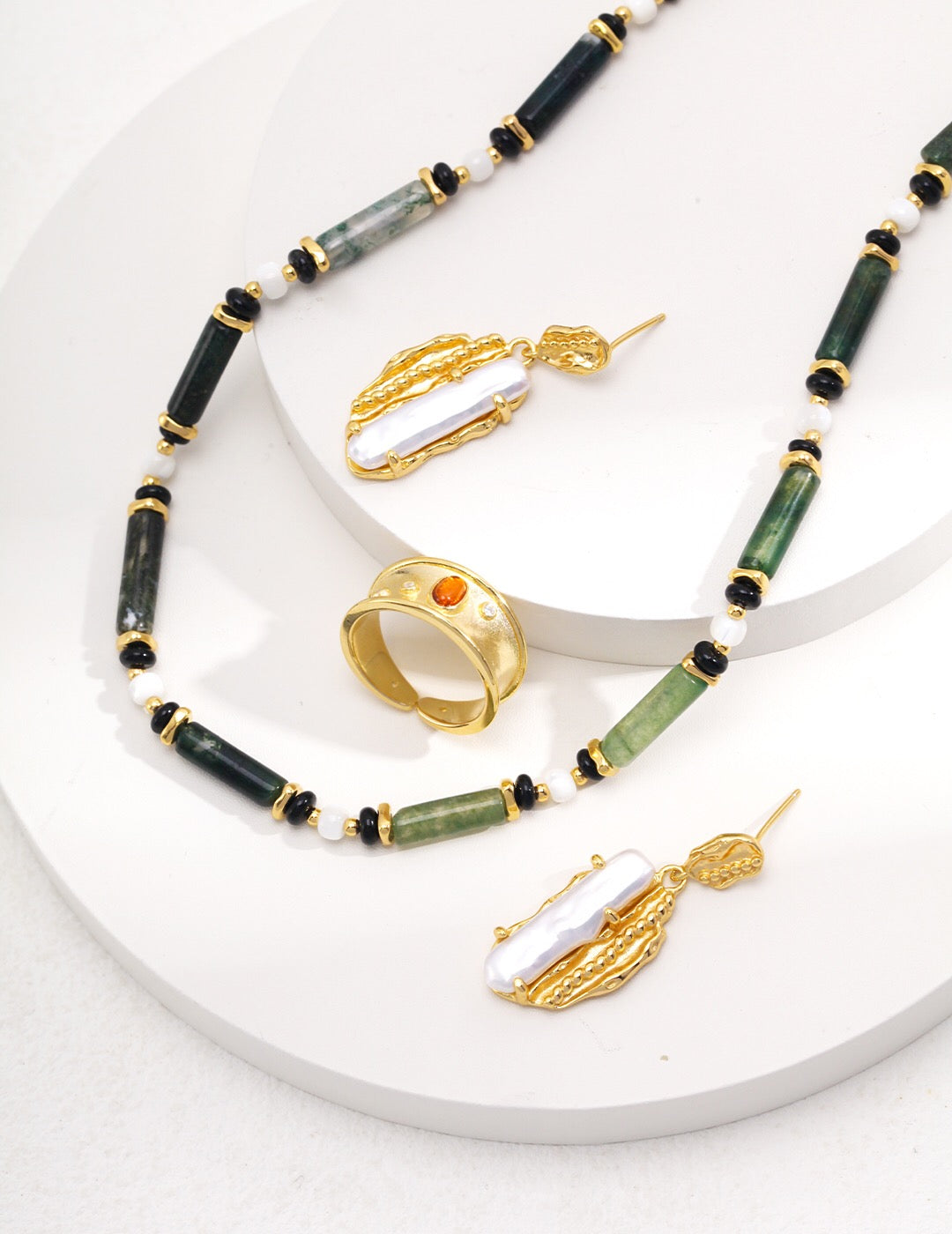 A handmade Aquatic Agate and Shell Necklace featuring gold vermeil accents, showcasing vibrant colors and natural patterns.