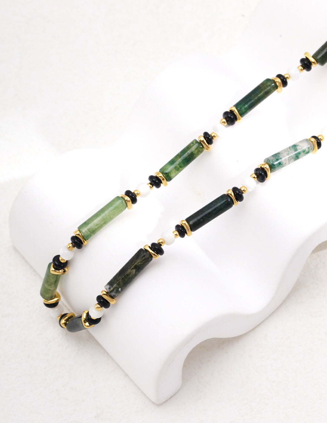 A handmade Aquatic Agate and Shell Necklace featuring gold vermeil accents, showcasing vibrant colors and natural patterns.