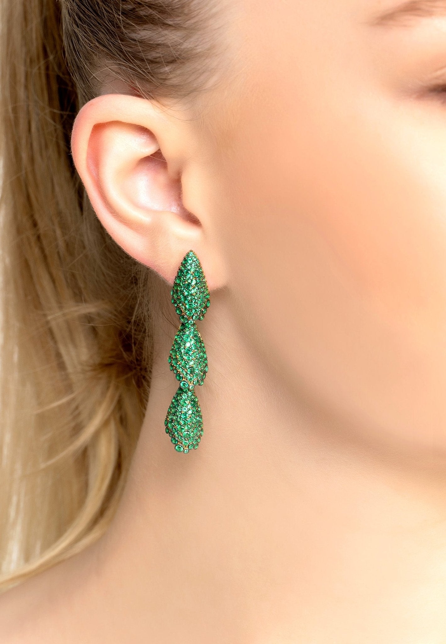 Elegant Arabelle Emerald Green Earrings Gold featuring a three-tiered shell design with emerald green cubic zirconia.