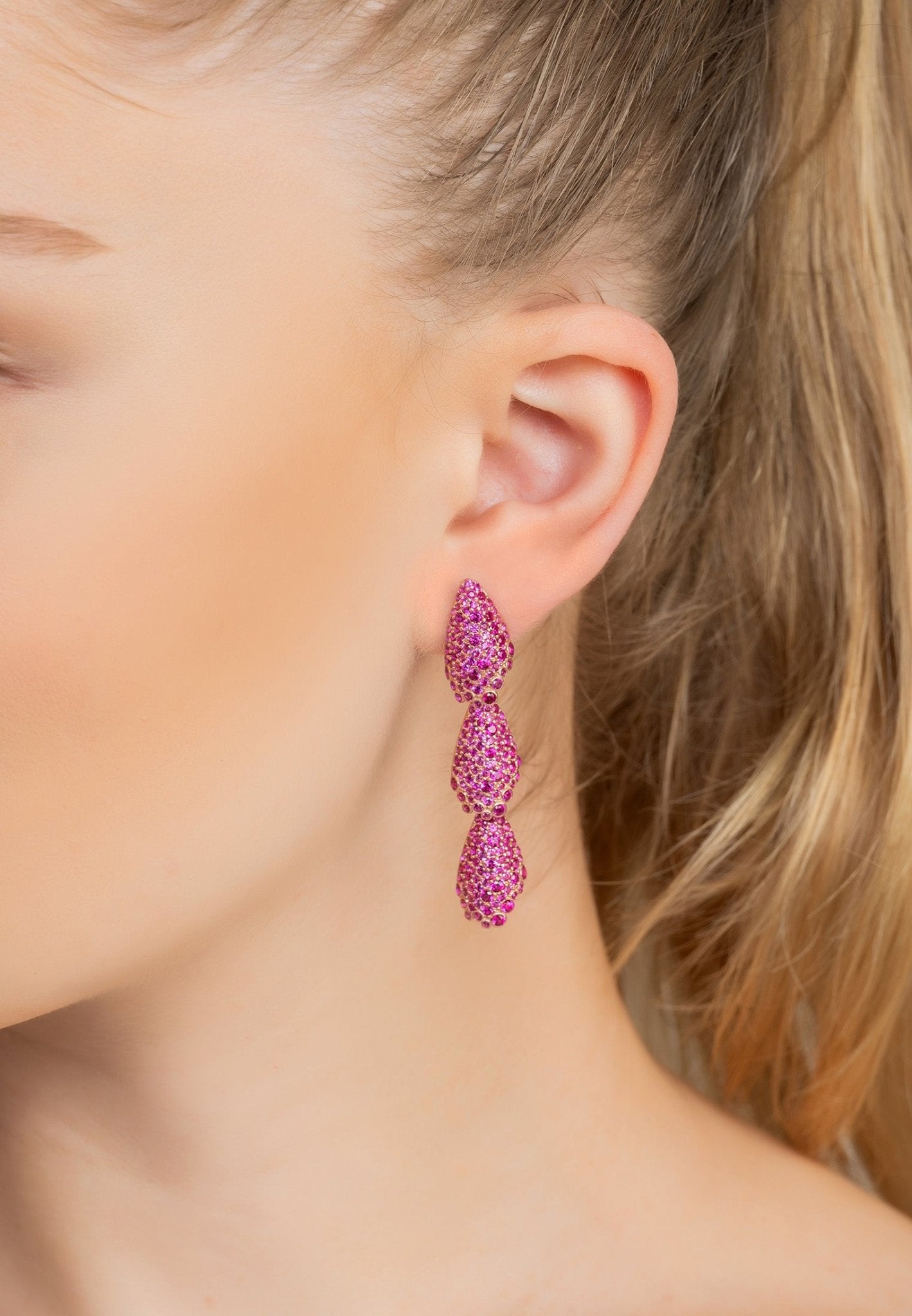 Stunning Arabelle Ruby Pink Earrings in rosegold, featuring vibrant cubic zirconia and unique shell-shaped motifs.