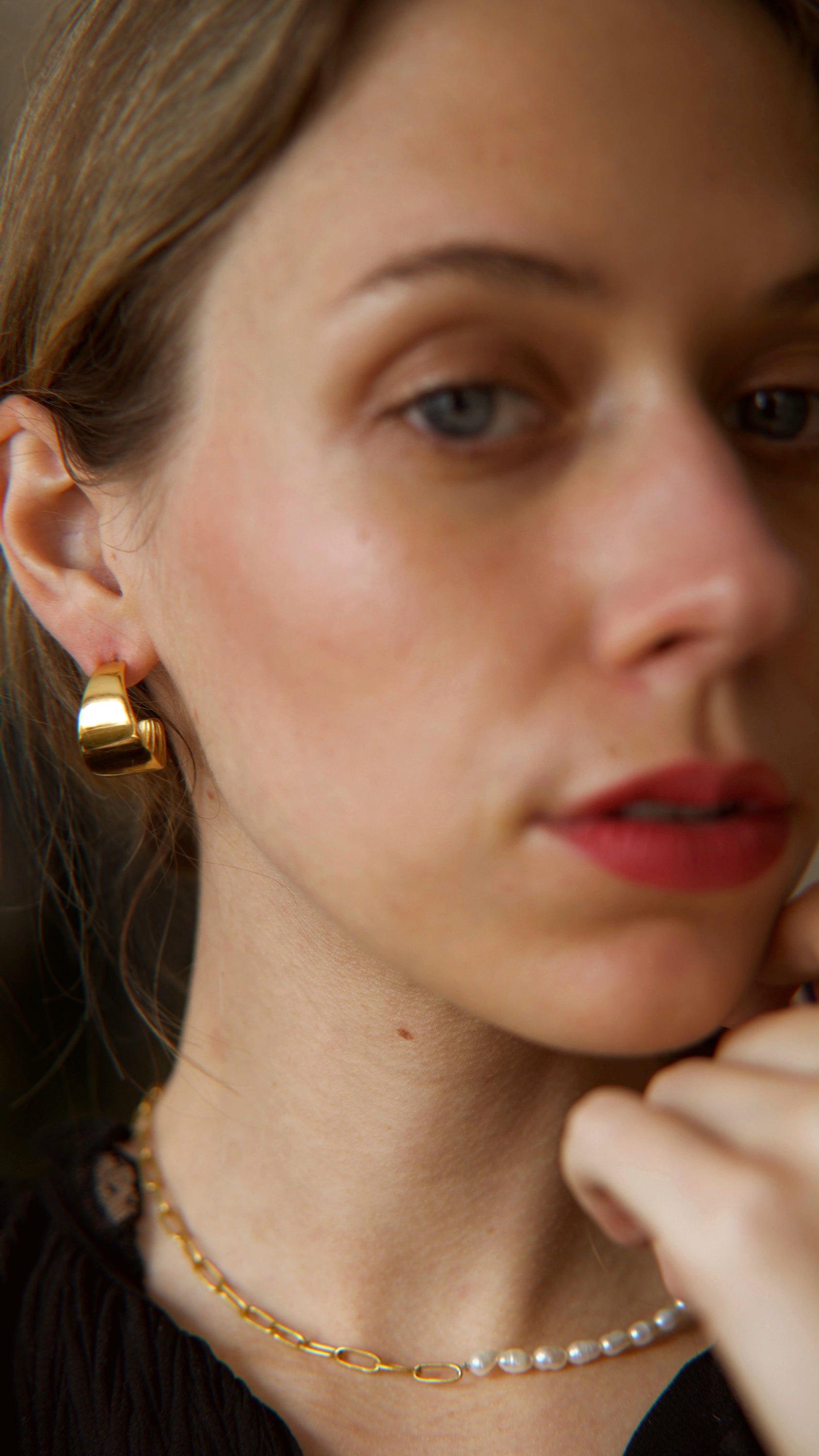 Ariel Luxurious Earrings featuring a bold hoop design in polished stainless steel with 18Kt yellow gold PVD plating.