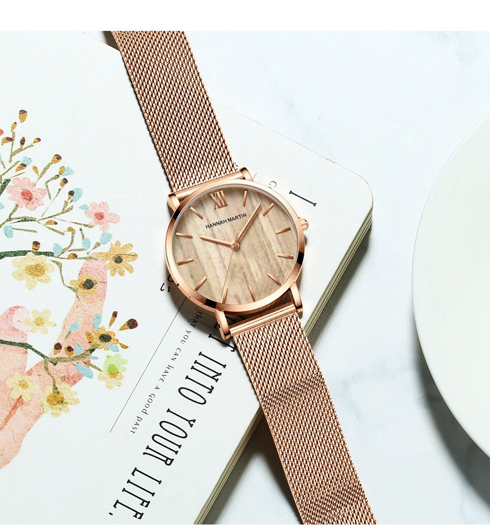 Arrival Japan Quartz Movement wood grain wristwatch with stainless steel mesh band, showcasing elegant design and functionality.