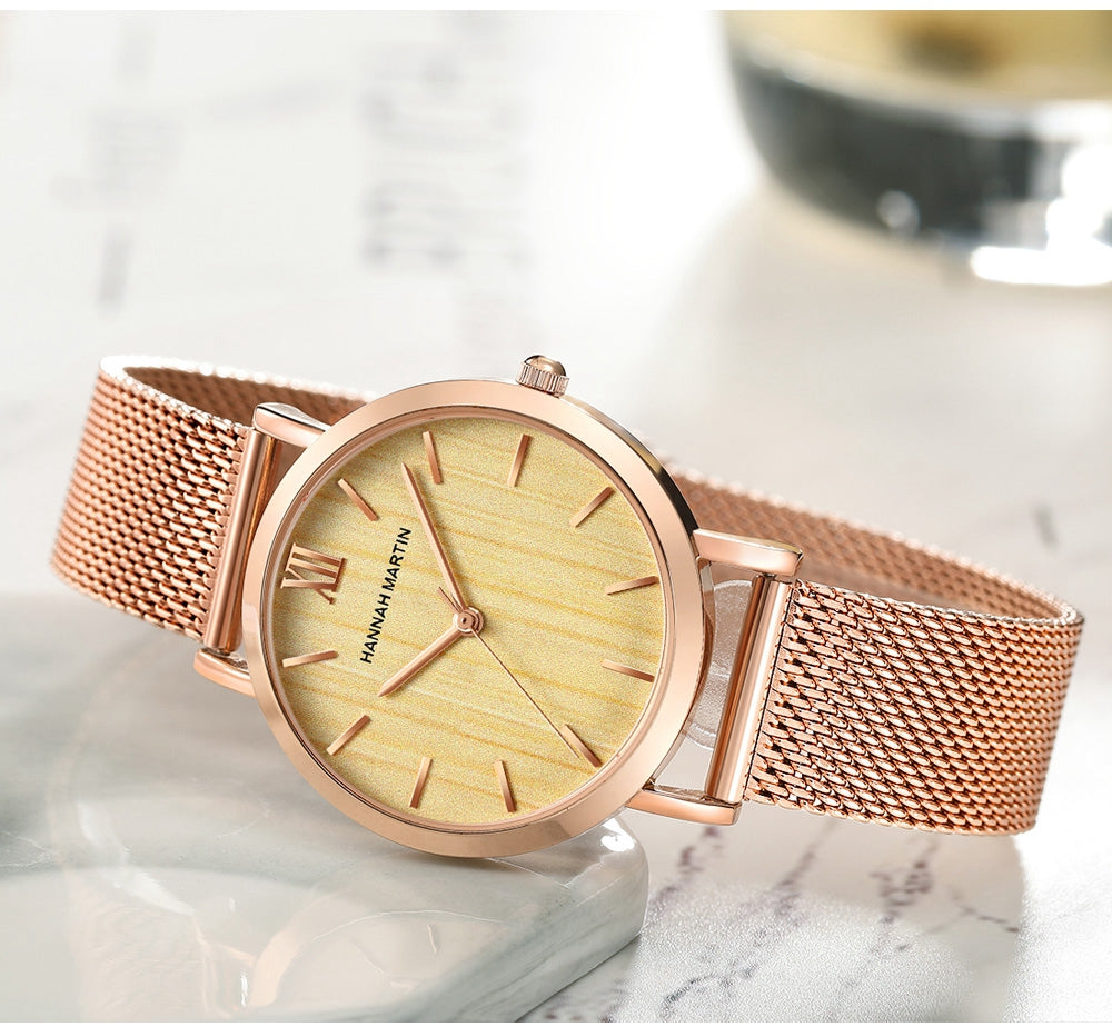 Arrival Japan Quartz Movement wood grain wristwatch with stainless steel mesh band, showcasing elegant design and functionality.