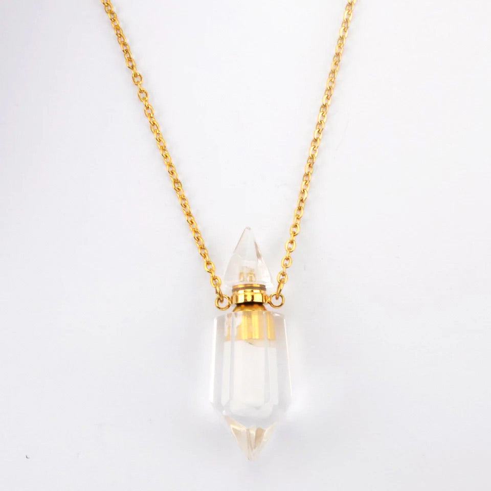 Aroma Gem Necklace featuring a crystal point pendant on an 18K gold plated chain, showcasing Amethyst, Clear Quartz, and Rose Quartz.