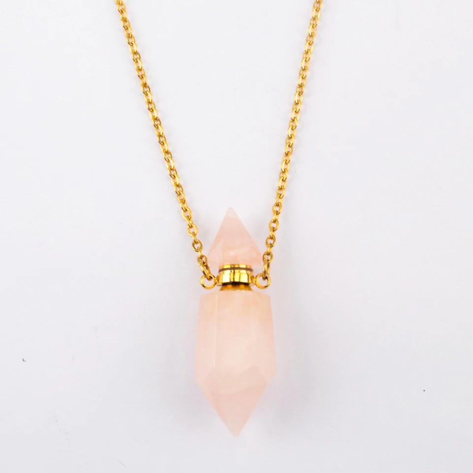 Aroma Gem Necklace featuring a crystal point pendant on an 18K gold plated chain, showcasing Amethyst, Clear Quartz, and Rose Quartz.