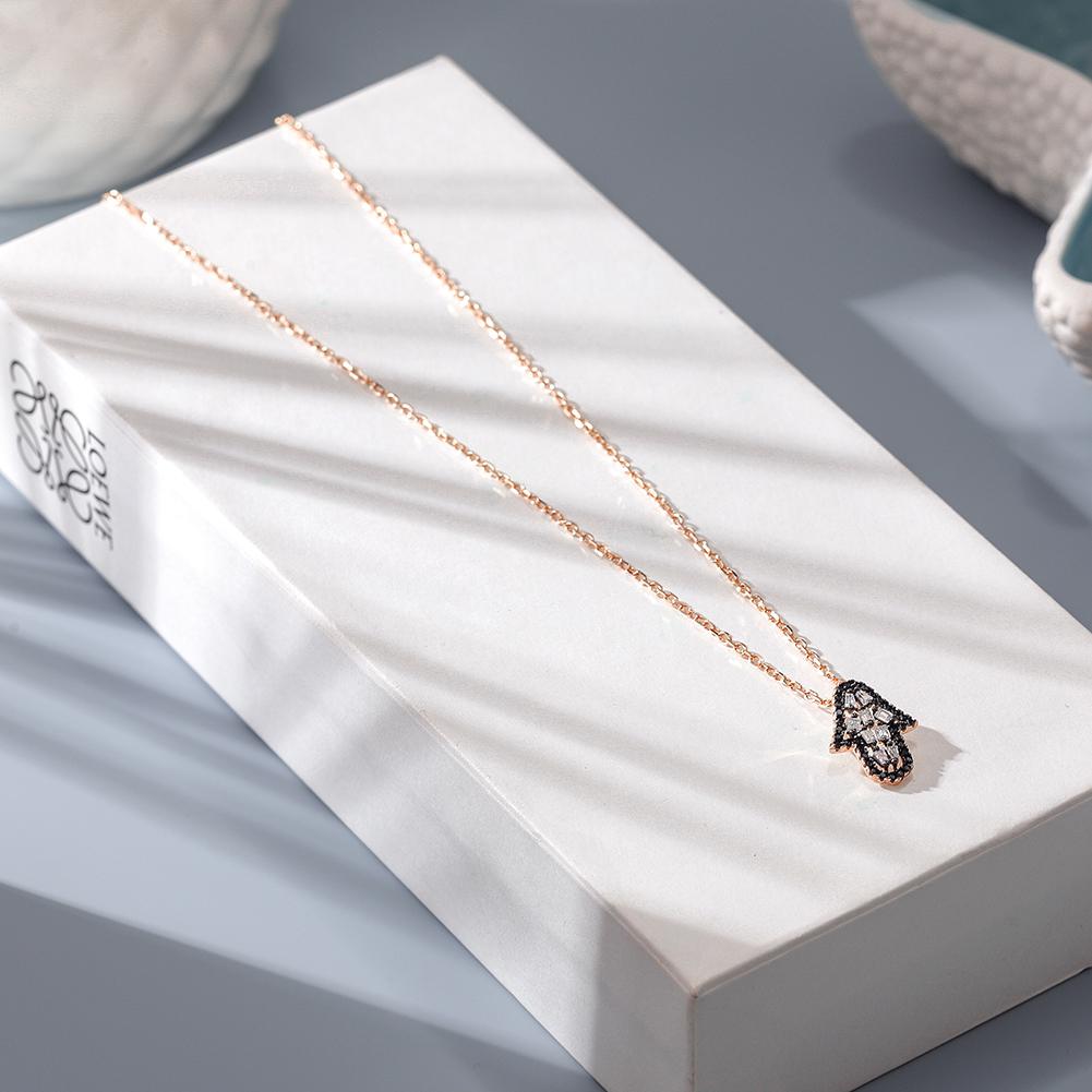 Elegant Arrowhead Pendant Necklace featuring CZ stones and a 14k gold chain, beautifully displayed in a gift box.