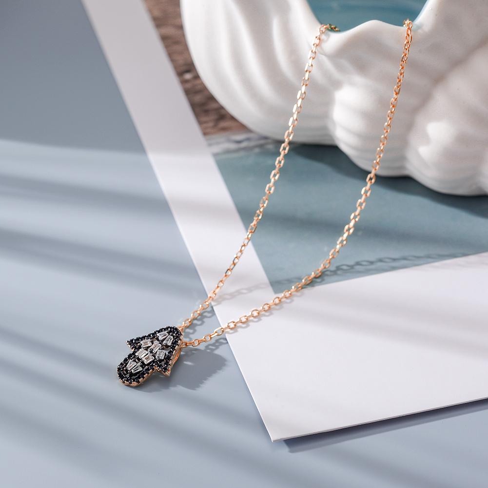 Elegant Arrowhead Pendant Necklace featuring CZ stones and a 14k gold chain, beautifully displayed in a gift box.