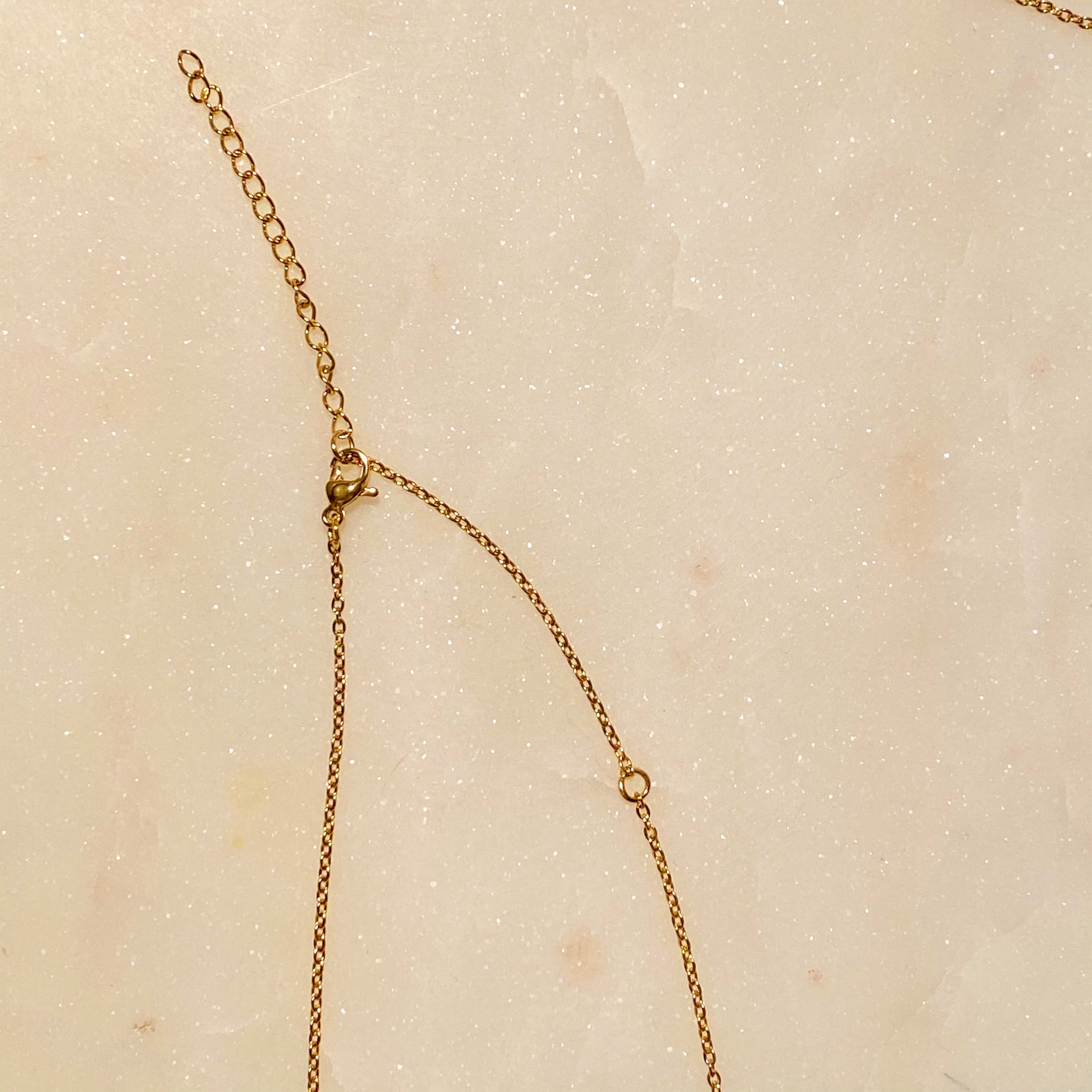 Art Deco Initial Necklace featuring a gold bar charm on a delicate chain, perfect for layering.