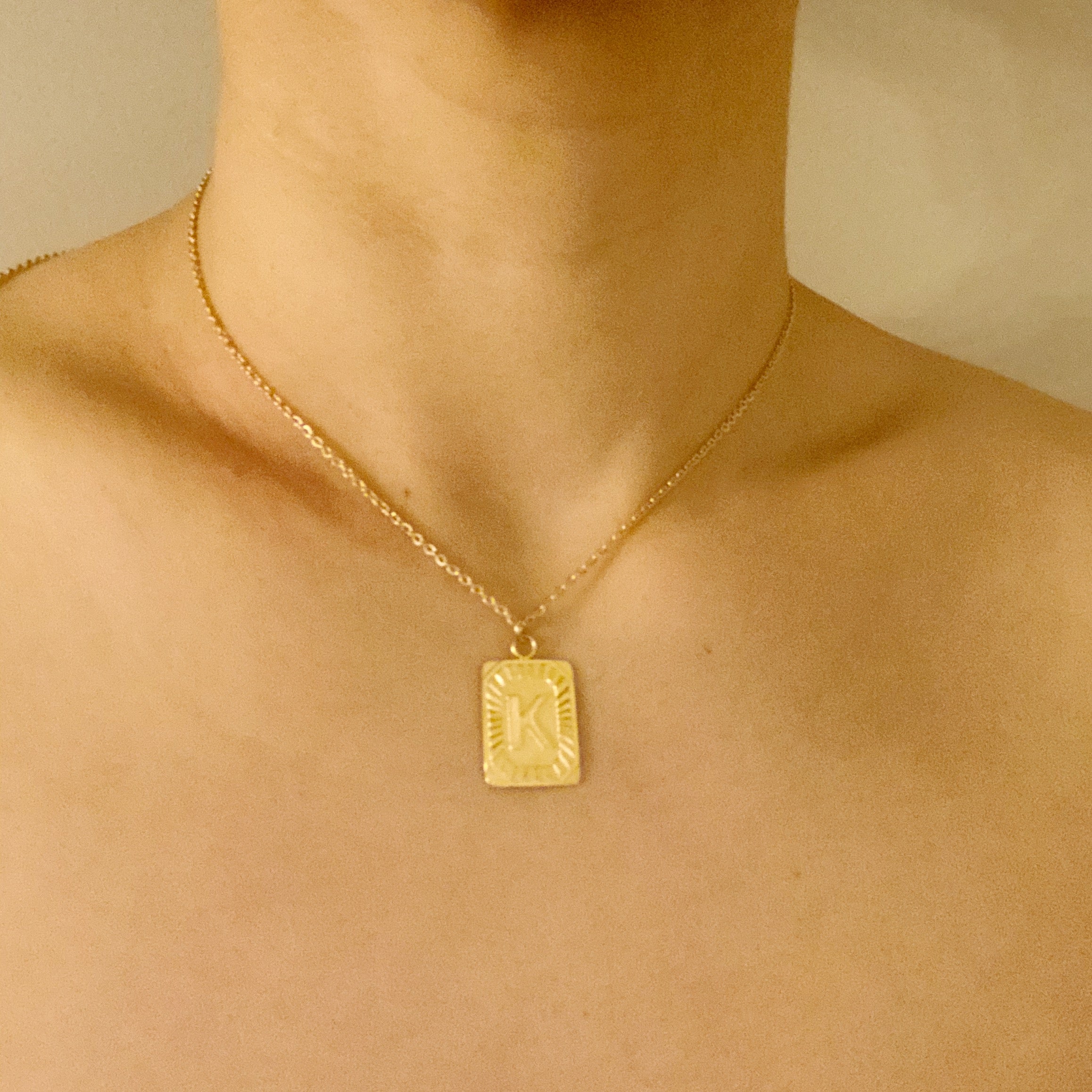 Art Deco Initial Necklace featuring a gold bar charm on a delicate chain, perfect for layering.