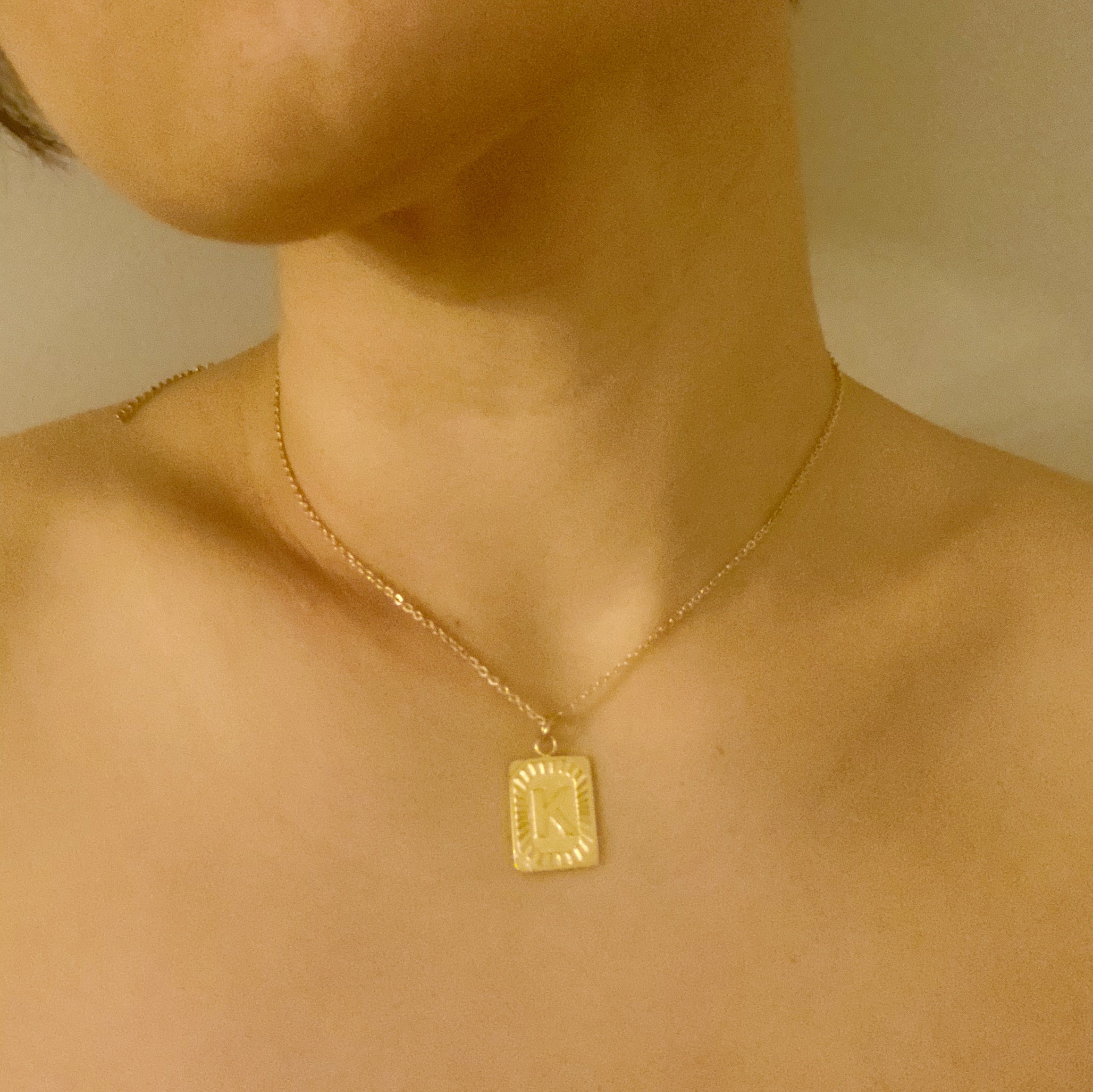 Art Deco Initial Necklace featuring a gold bar charm on a delicate chain, perfect for layering.