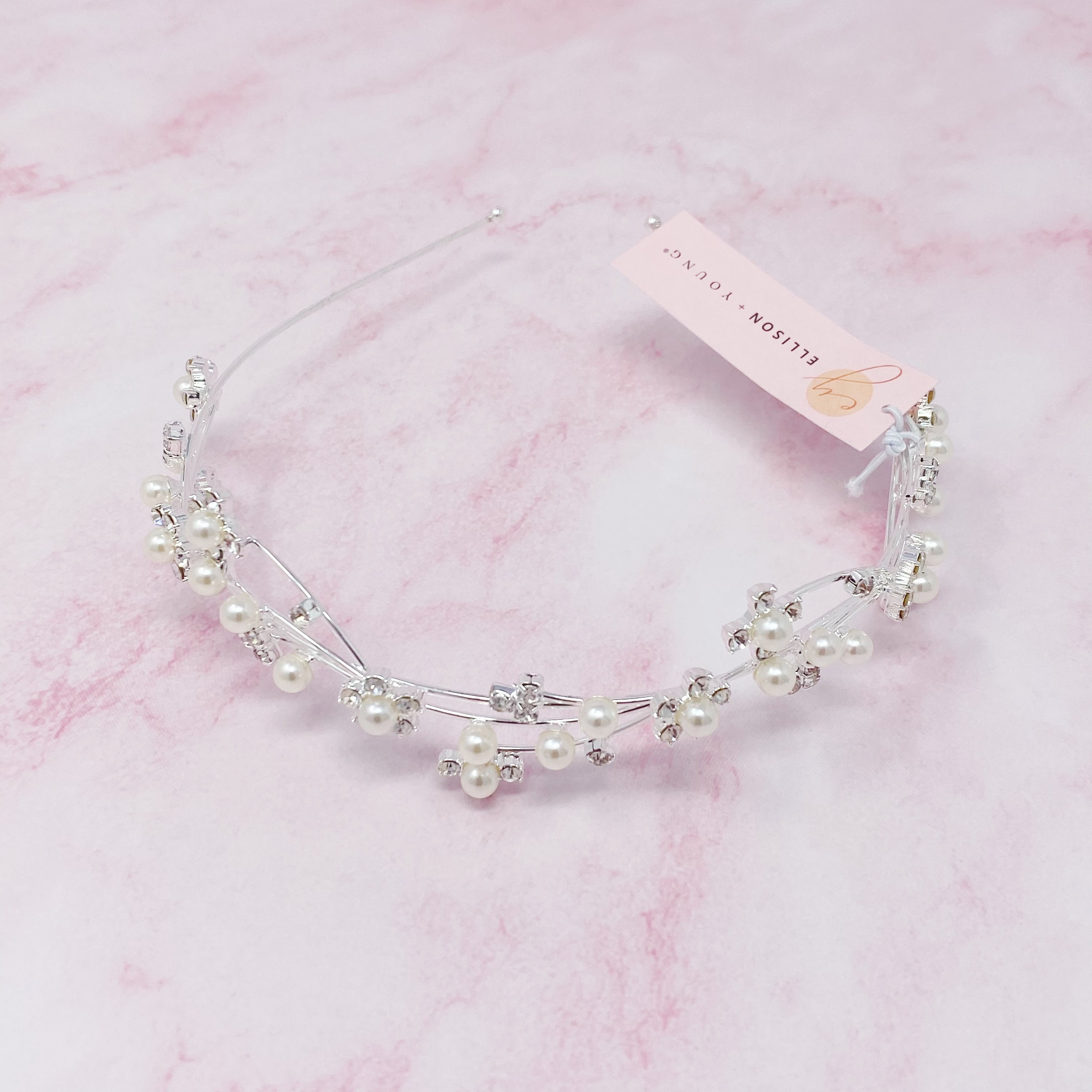 Artful Snow Flower Headband featuring pearls and sparkly stones on a delicate wire frame.