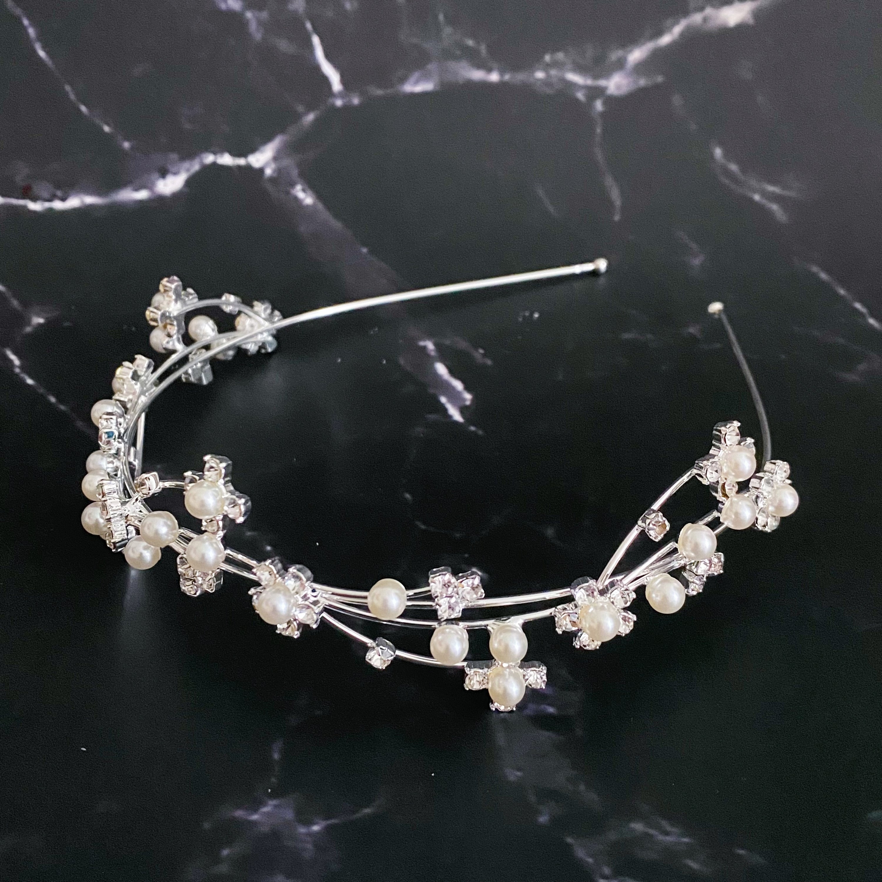 Artful Snow Flower Headband featuring pearls and sparkly stones on a delicate wire frame.