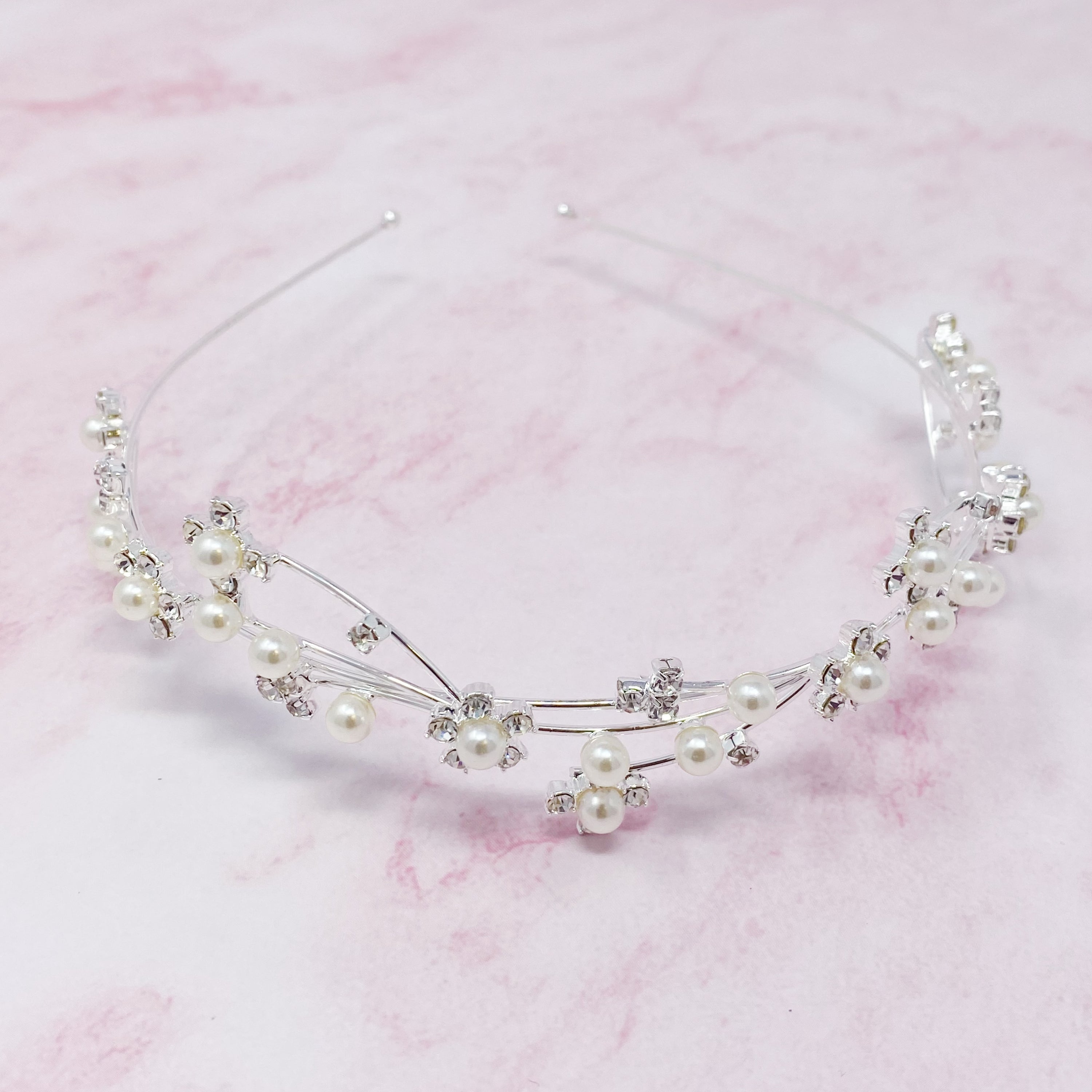 Artful Snow Flower Headband featuring pearls and sparkly stones on a delicate wire frame.