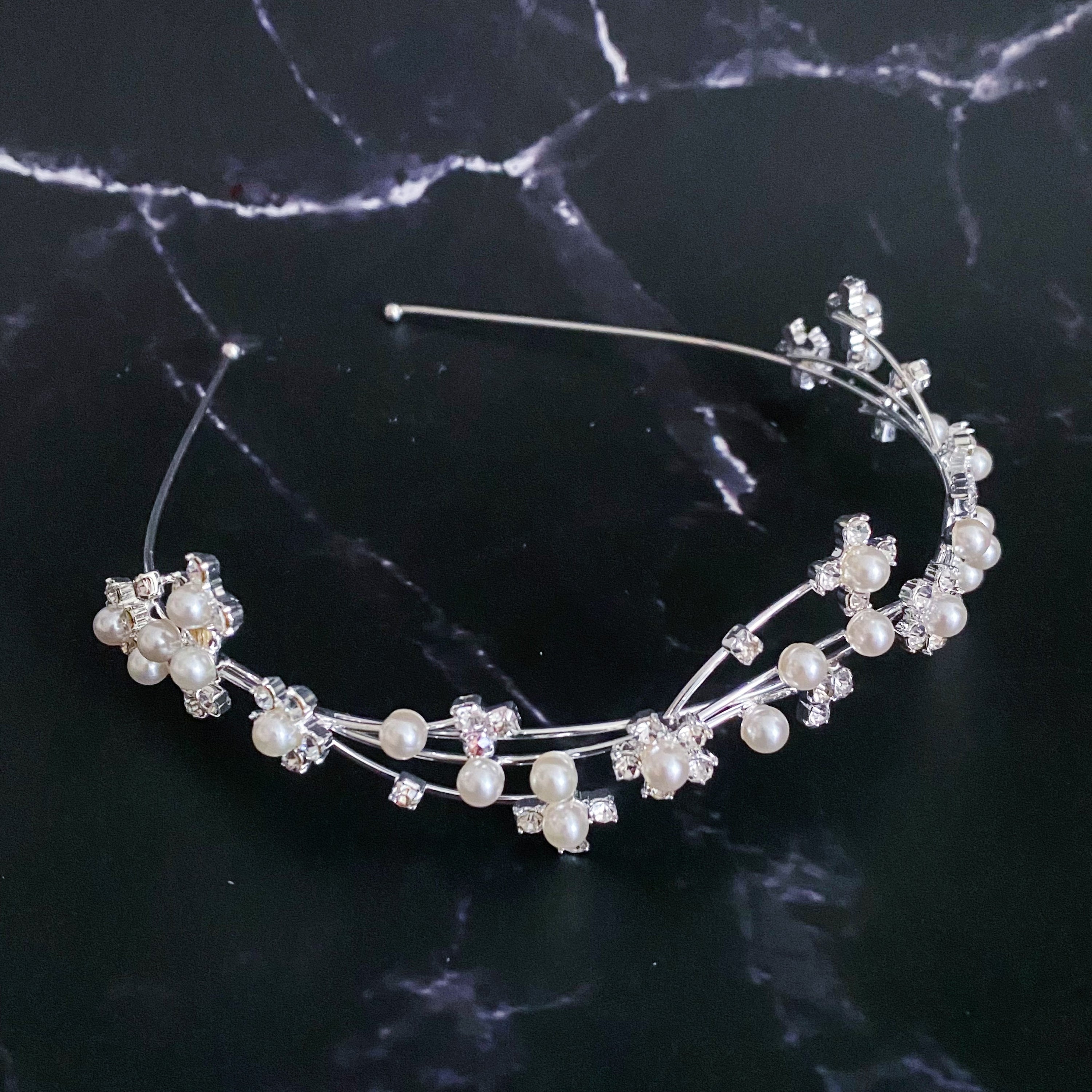 Artful Snow Flower Headband featuring pearls and sparkly stones on a delicate wire frame.