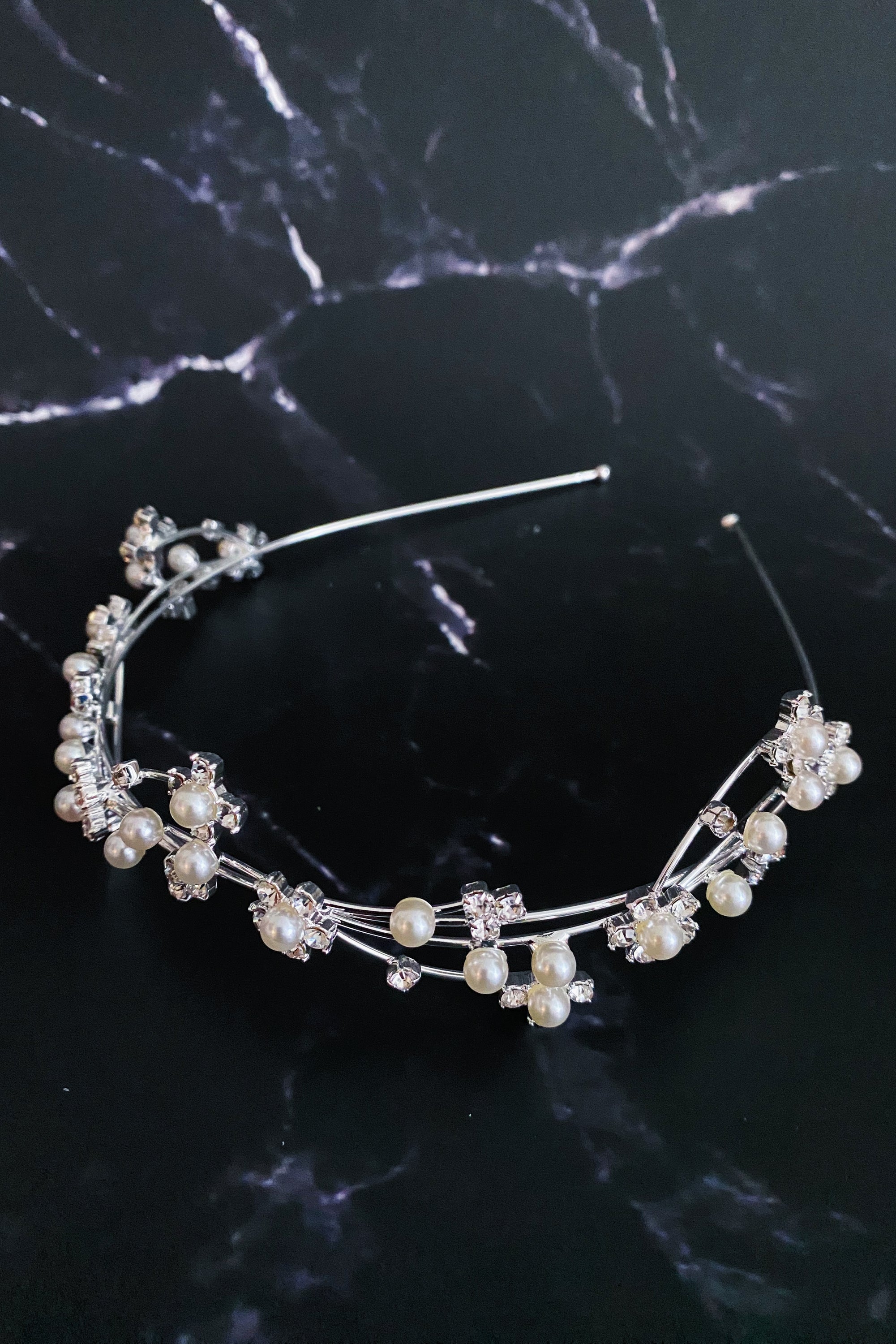 Artful Snow Flower Headband featuring pearls and sparkly stones on a delicate wire frame.