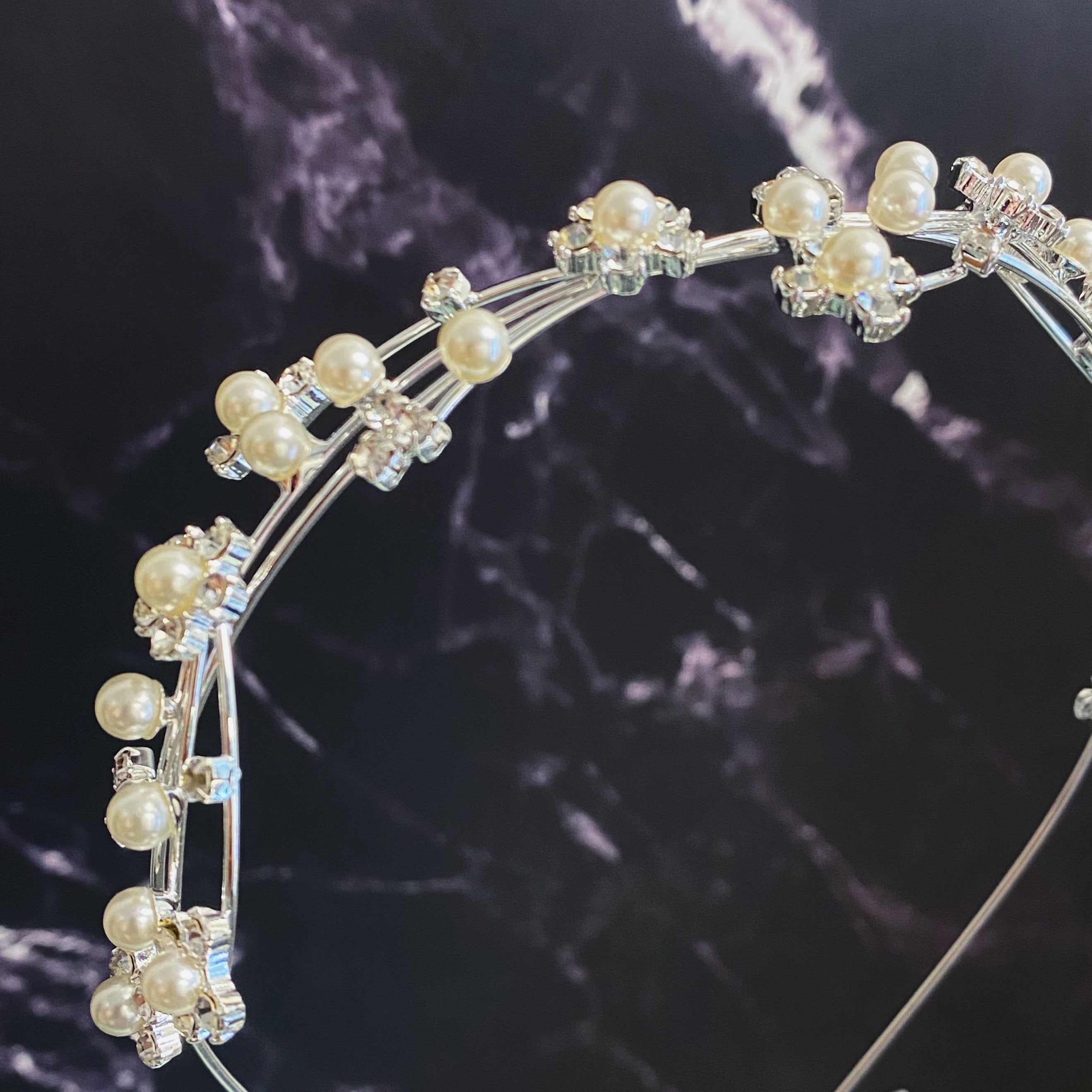 Artful Snow Flower Headband featuring pearls and sparkly stones on a delicate wire frame.