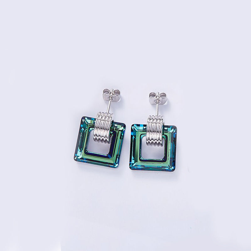 Aruba Blue Cubic Zirconia Square Shaped Studs in Rhodium Plating, showcasing vibrant blue stones and elegant design.