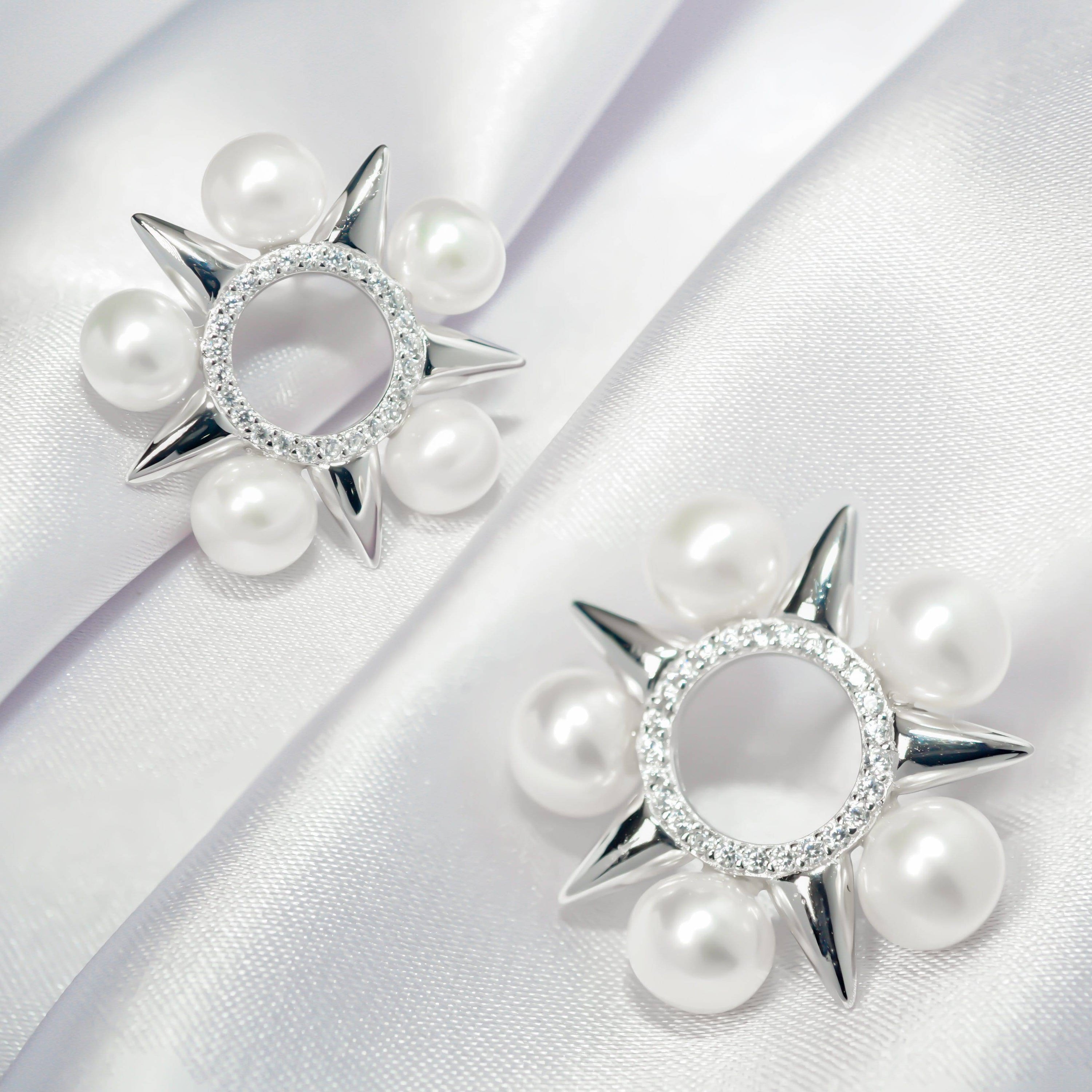 Asian Civilisations Museum Freshwater Pearl Earrings featuring a five-point star design with lustrous pearls and sterling silver.