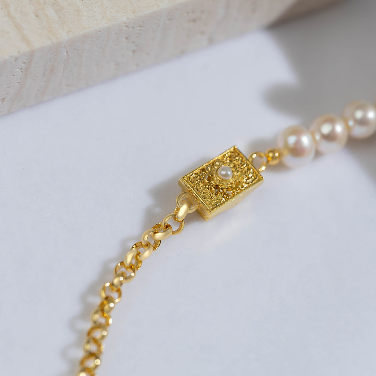 Asian Civilisations Museum Freshwater Pearl Necklace featuring round white pearls and sterling silver with 18k gold plating, showcasing traditional dokoh design.