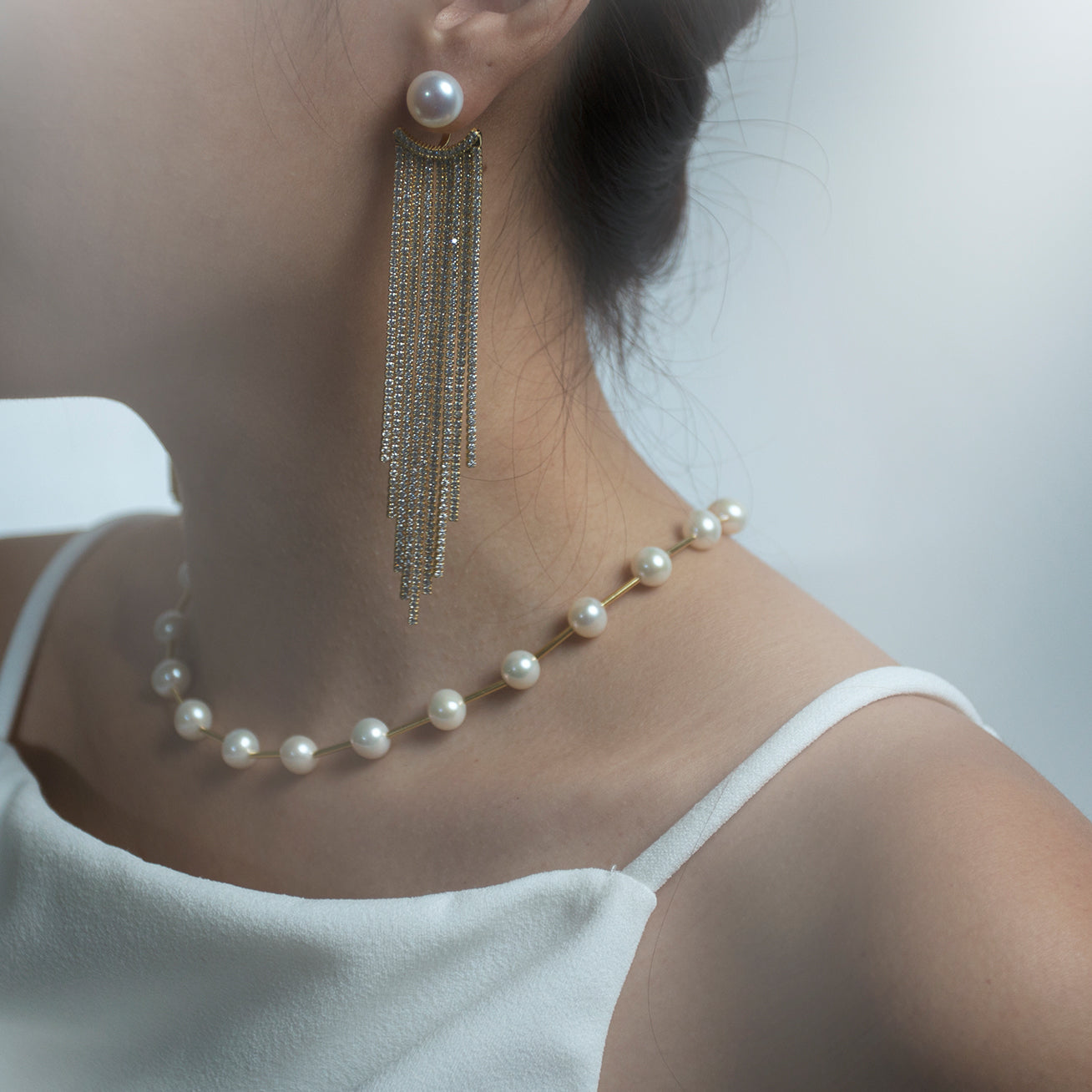 Asian Civilisations Museum Freshwater Pearl Necklace featuring lustrous white pearls and elegant spiral design in sterling silver with gold plating.