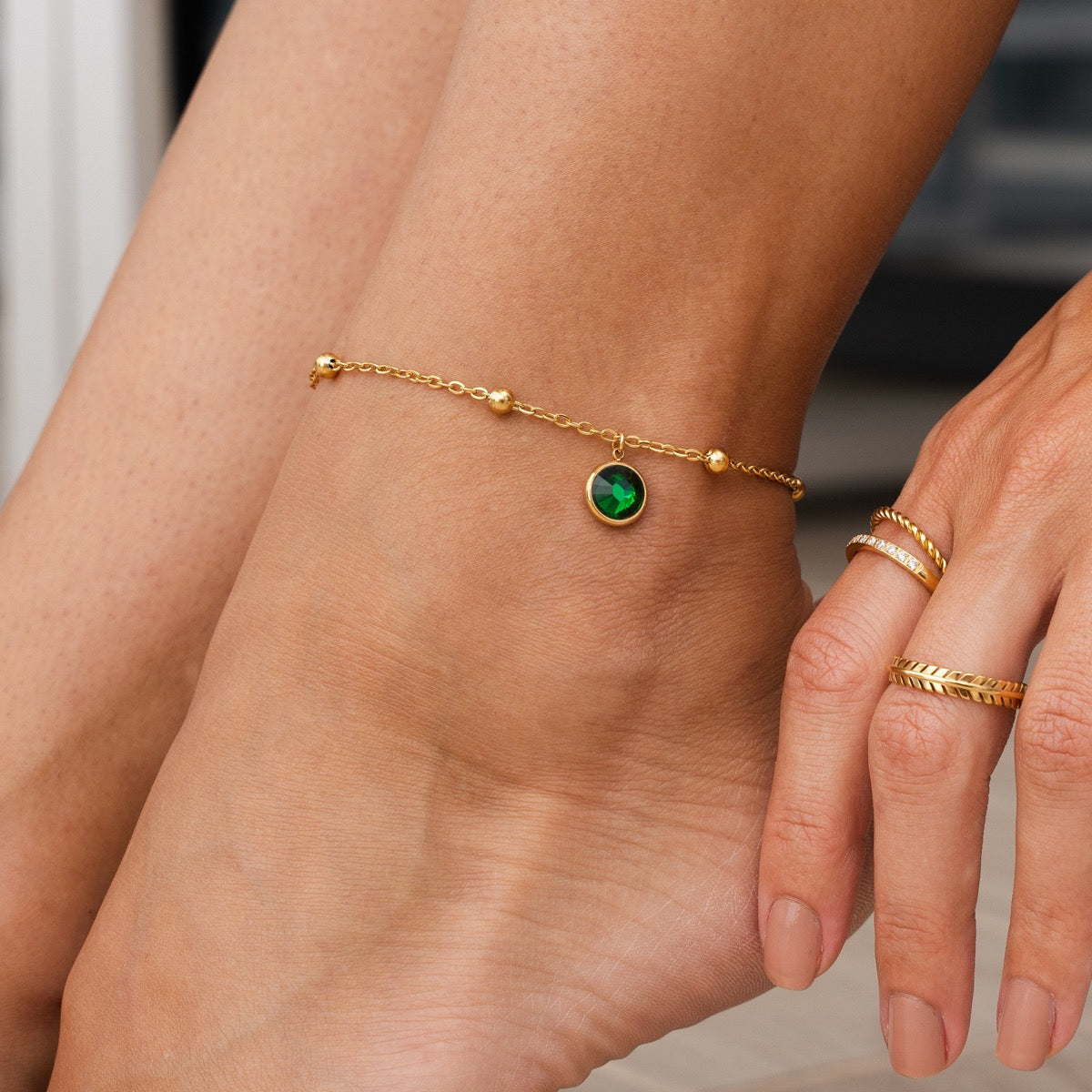 Asma Emerald Ball Chain in gold with emerald balls, showcasing its elegant design and premium quality.