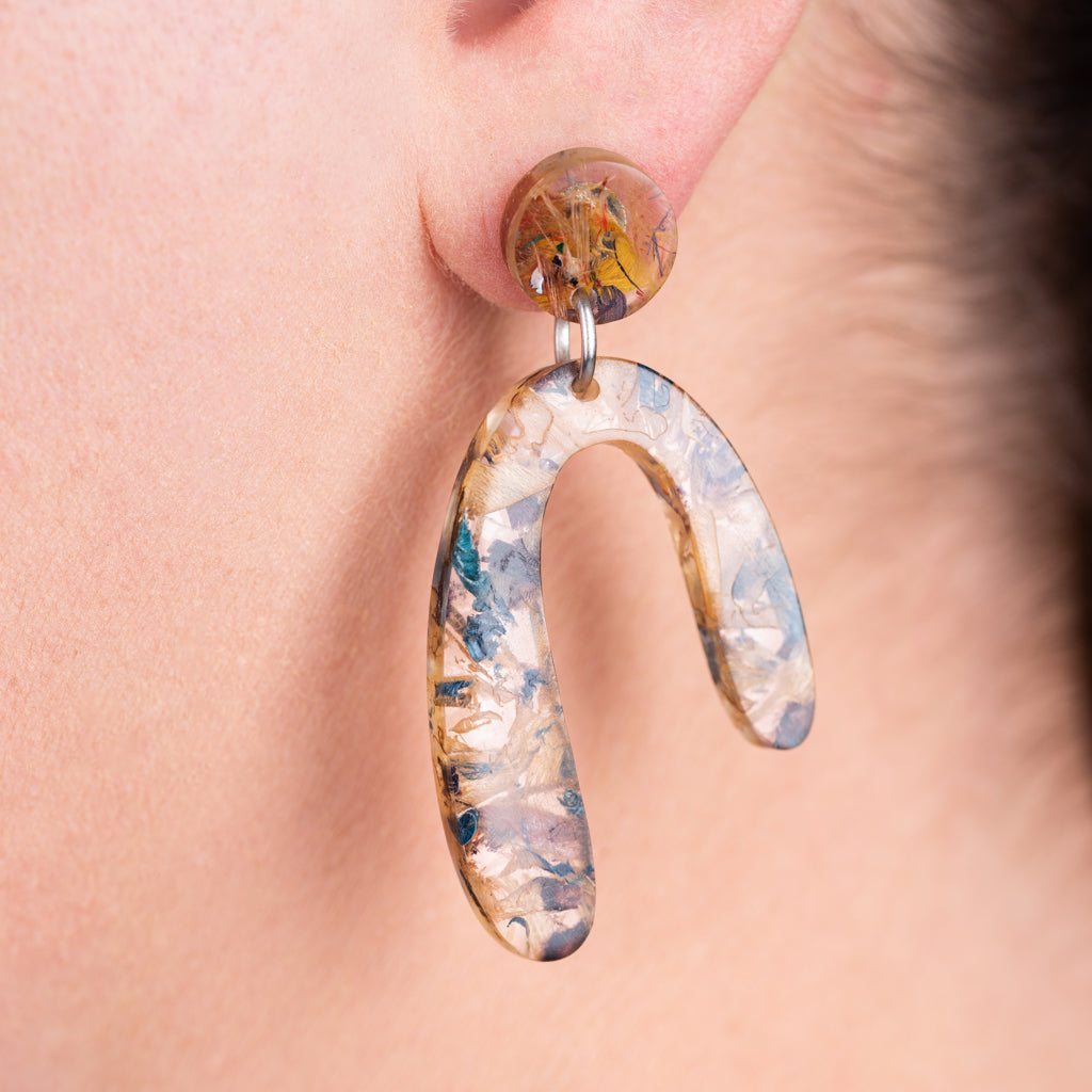 Aspen U Shaped Statement Resin Earrings made from recycled skateboard shavings and plant resin, showcasing unique colors and patterns.