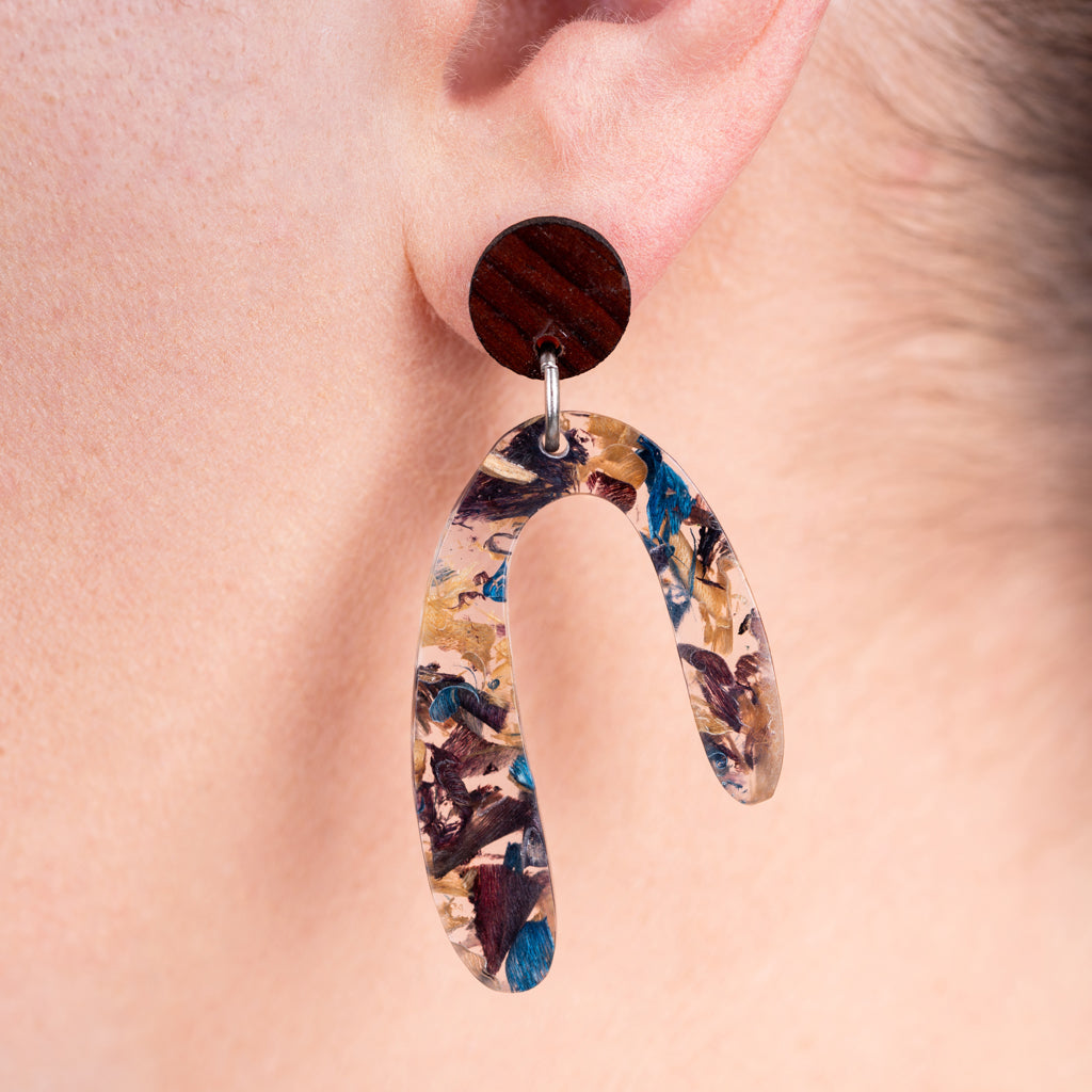 Aspen U Shaped Statement Resin Earrings made from recycled skateboard shavings and plant resin, showcasing unique colors and patterns.