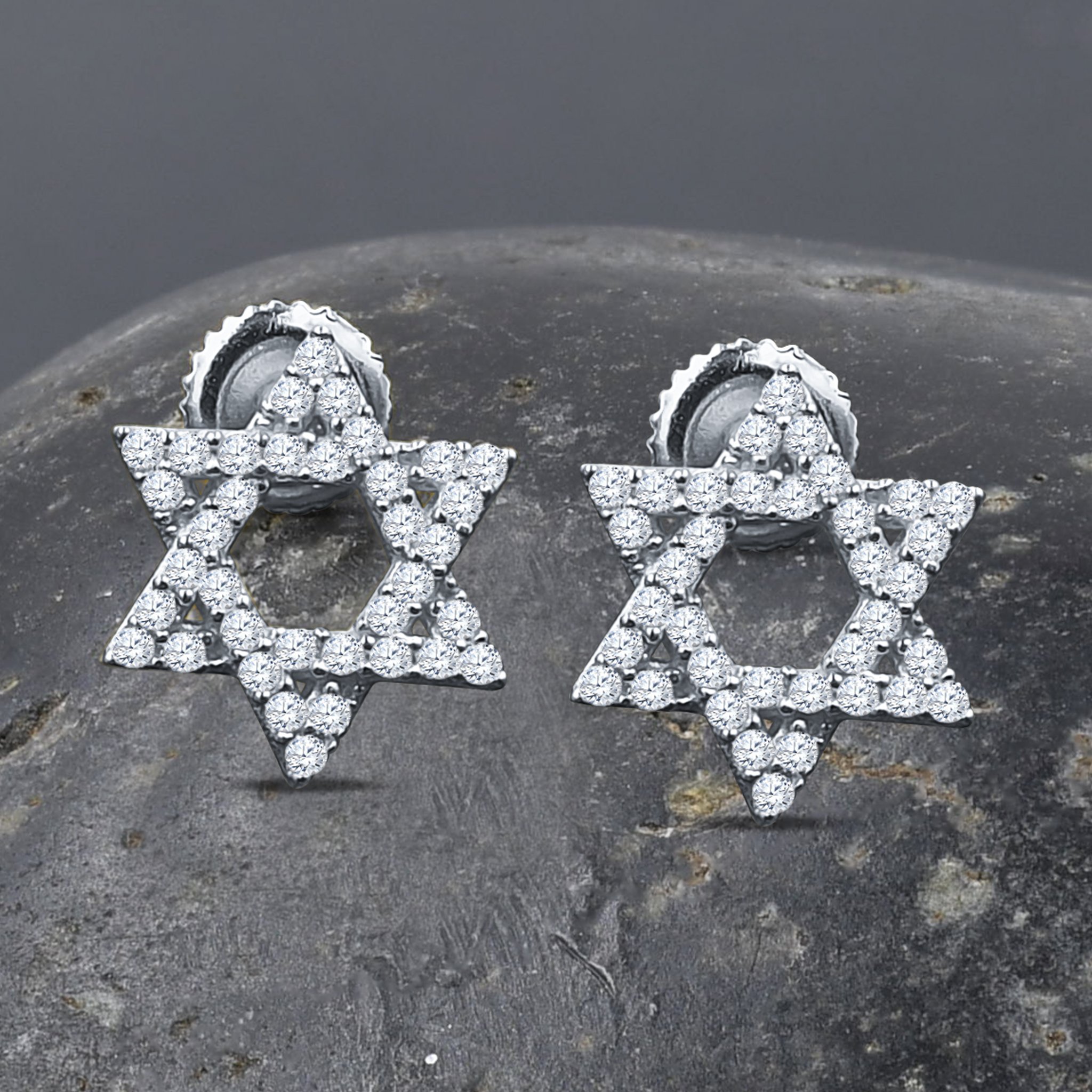 ASTRAL Silver Earrings featuring cubic zirconia stones in a star-like design, crafted from 925 sterling silver.