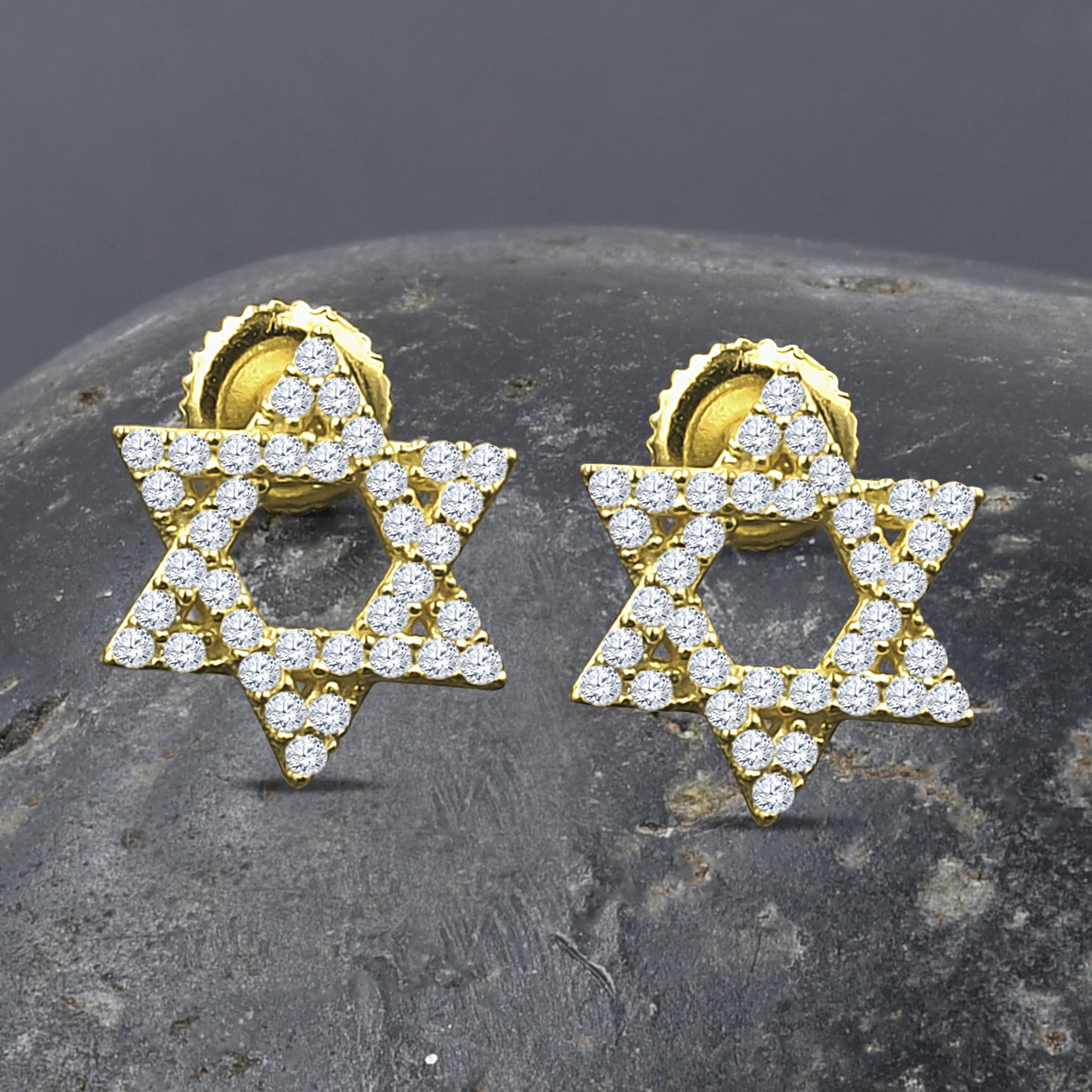 A pair of ASTRAL Silver Earrings featuring cubic zirconia stones in a star-like design, crafted from 925 sterling silver.