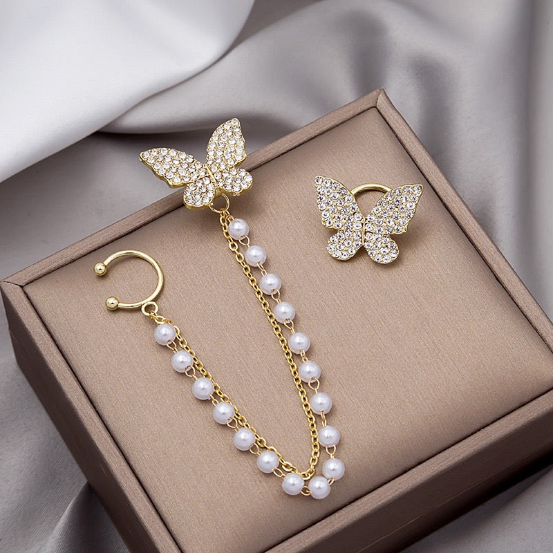 Asymmetric butterfly earring featuring a pearl ear clip, crafted from alloy, showcasing a unique design.