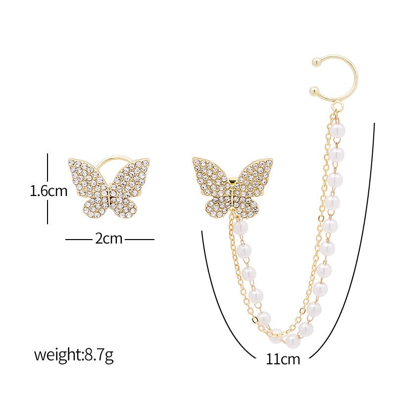 Asymmetric butterfly earring featuring a pearl ear clip, crafted from alloy, showcasing a unique design.