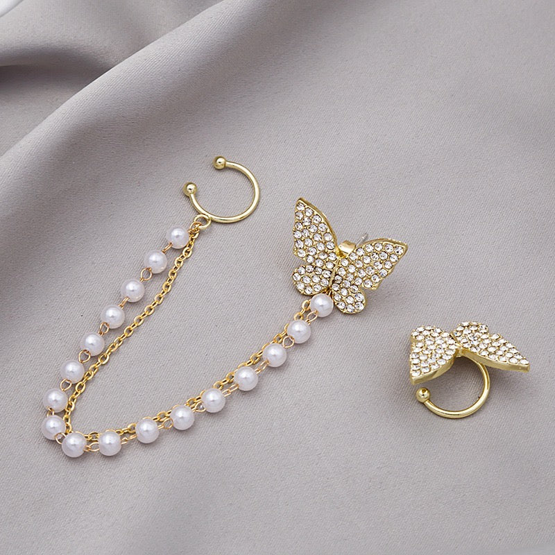 Asymmetric butterfly earring featuring a pearl ear clip, crafted from alloy, showcasing a unique design.