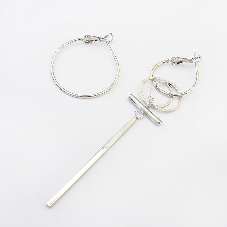 A pair of stylish asymmetric hoops and stick earrings made from alloy, showcasing a modern design with a unique shape.