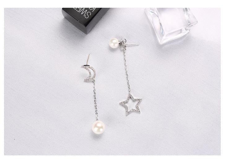 Asymmetric earrings featuring a moon and star design with artificial pearls, crafted from S925 alloy.