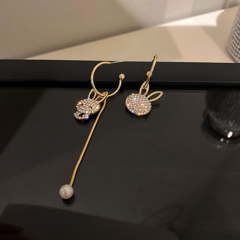 Asymmetric Shining Cute Rabbit Earrings featuring rhinestones and artificial pearls, showcasing a playful and elegant design.