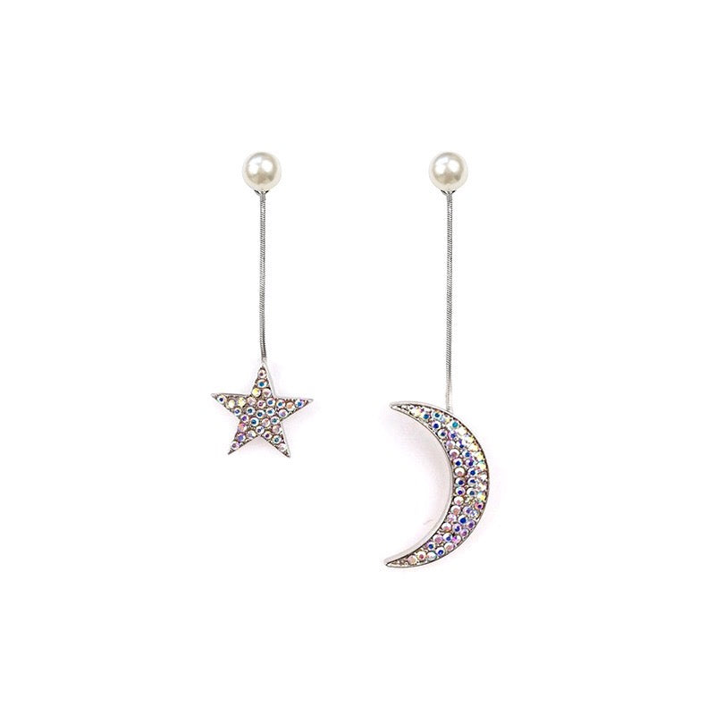 Asymmetric earrings featuring moon and star designs, adorned with pearls and rhinestones, showcasing a celestial theme.