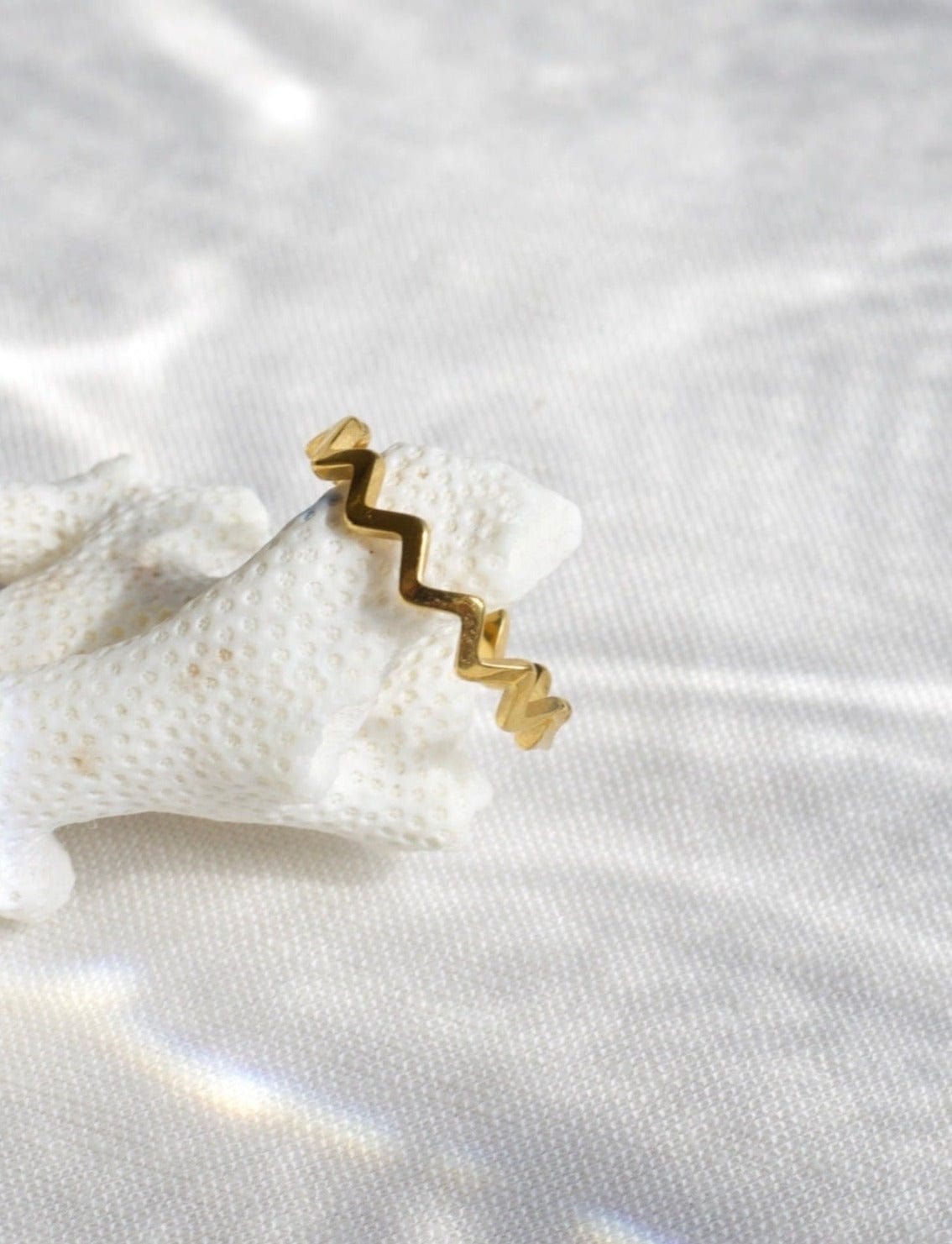 Atticus Dainty ZigZag Stacking Ring in gold, showcasing its minimalist geometric design and elegant finish.