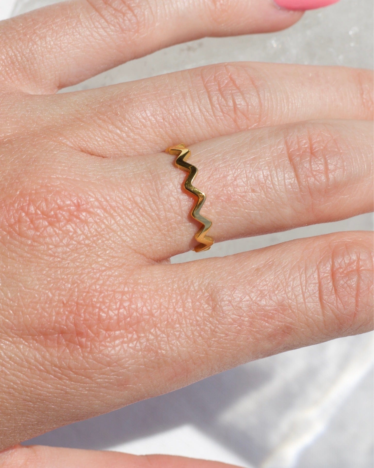 Atticus Dainty ZigZag Stacking Ring in gold, showcasing its minimalist geometric design and elegant finish.