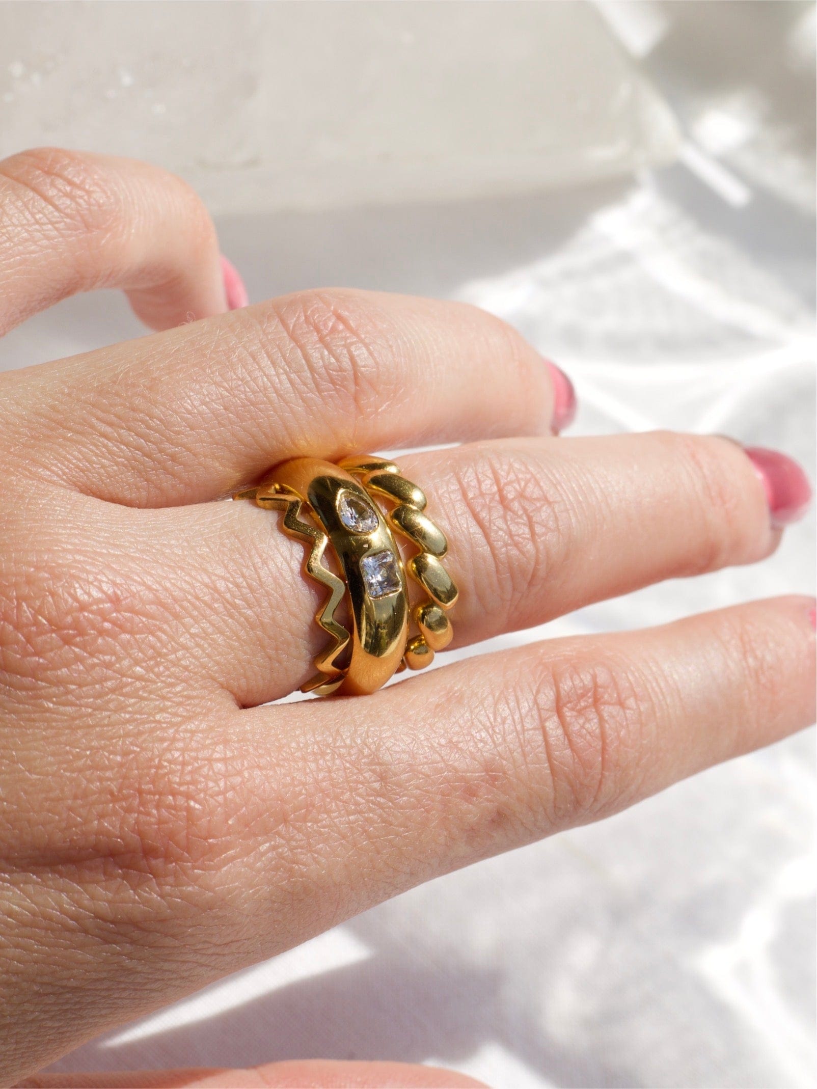 Atticus Dainty ZigZag Stacking Ring in gold, showcasing its minimalist geometric design and elegant finish.