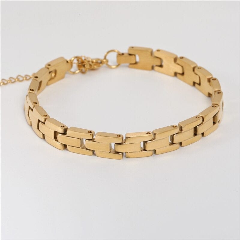 Aubree Panther Link Bracelet featuring chunky gold and silver links, showcasing its elegant design and durable materials.