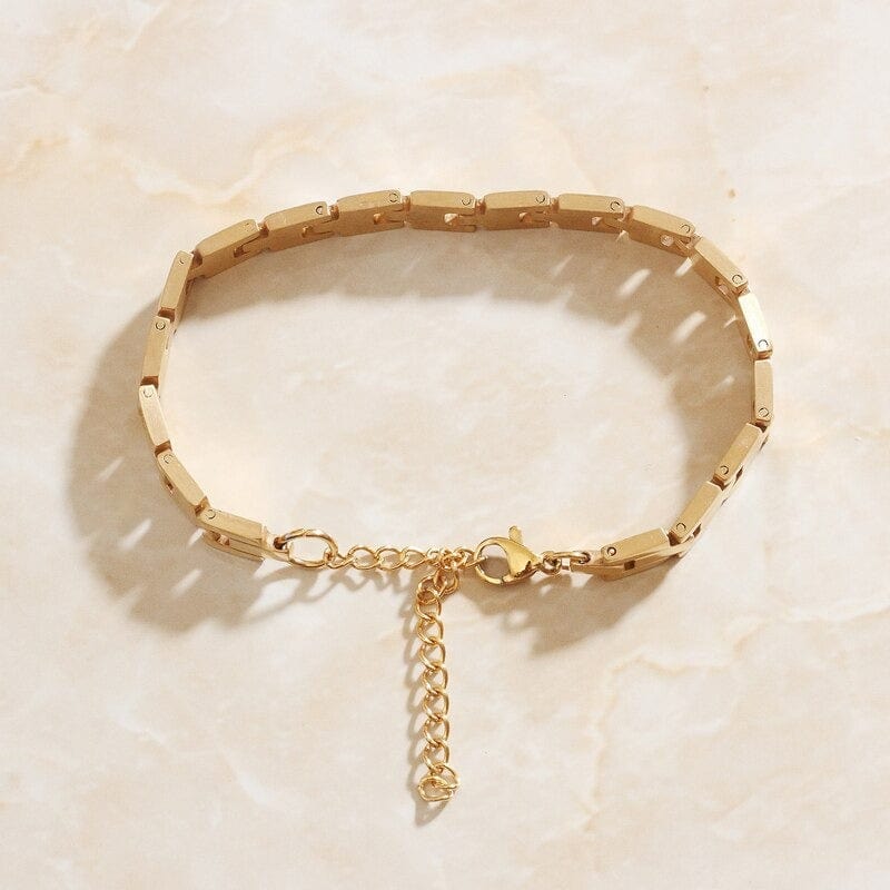 Aubree Panther Link Bracelet featuring chunky gold and silver links, showcasing its elegant design and durable materials.