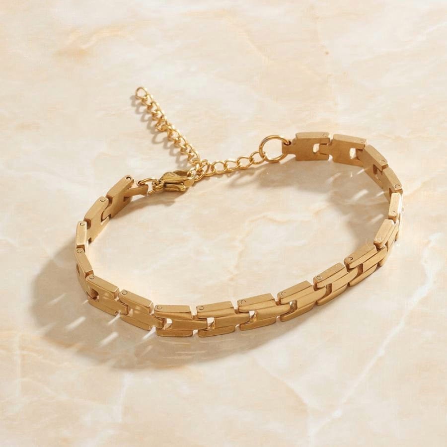 Aubree Panther Link Bracelet featuring chunky gold and silver links, showcasing its elegant design and durable materials.