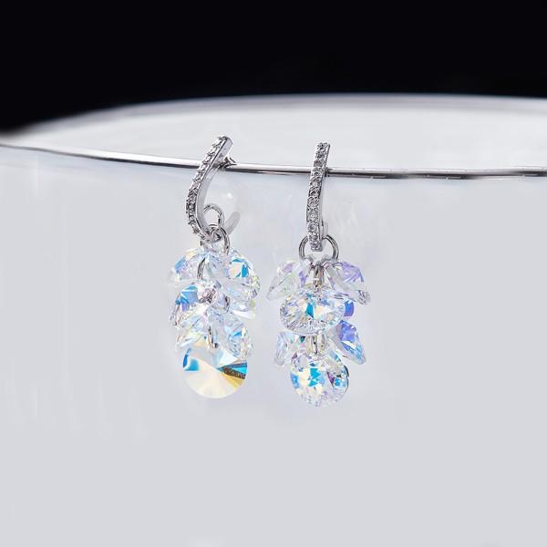 Elegant Aurora Borealis dangling cluster grapevine earrings in 14K white gold, featuring circular stones that shimmer with vibrant colors.