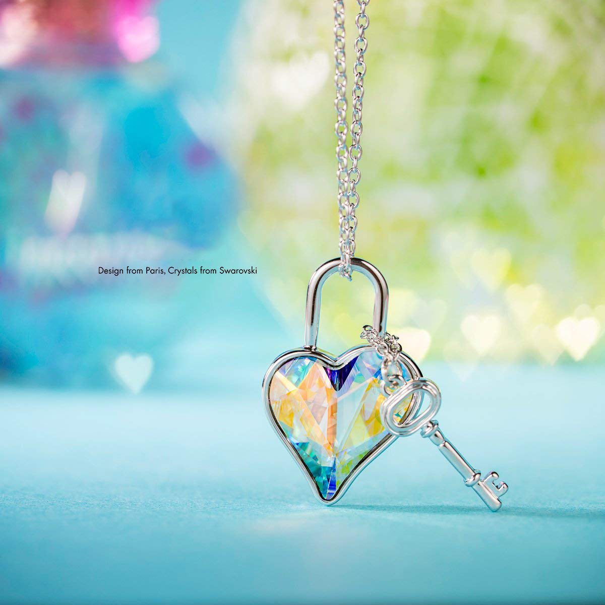 Aurora Borealis The Key To My Heart Pendant Necklace featuring a heart-shaped AAAAA crystal on a 14K white gold plated link chain.