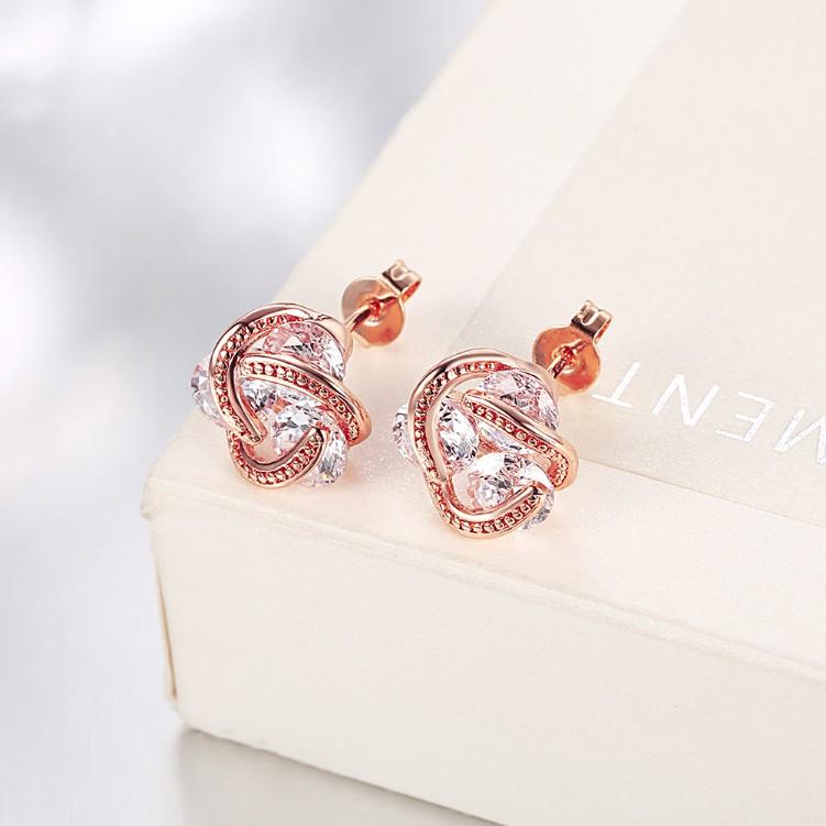 Austrian Crystal Knot Stud Earrings set in rose gold, featuring a delicate knot design and butterfly backing for secure wear.