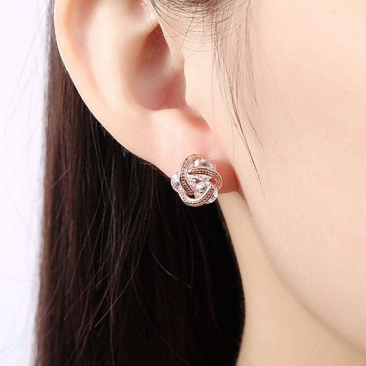 Austrian Crystal Knot Stud Earrings set in rose gold, featuring a delicate knot design and butterfly backing for secure wear.