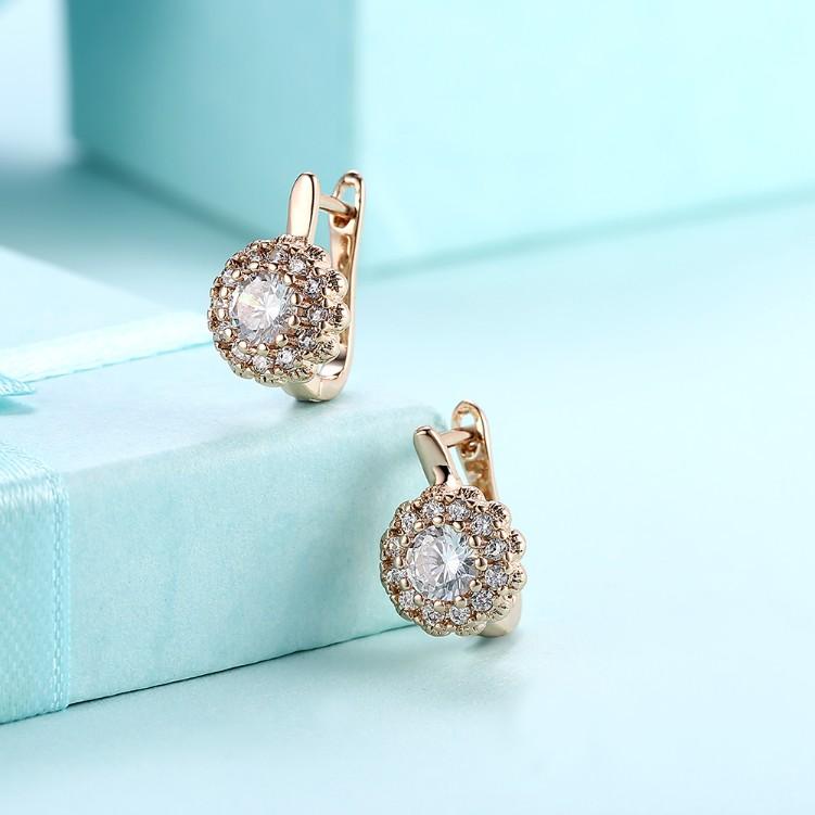 Austrian Crystal Micro Pav'e Bursting Star Leverback Earrings featuring 18K gold plating and a sparkling design.